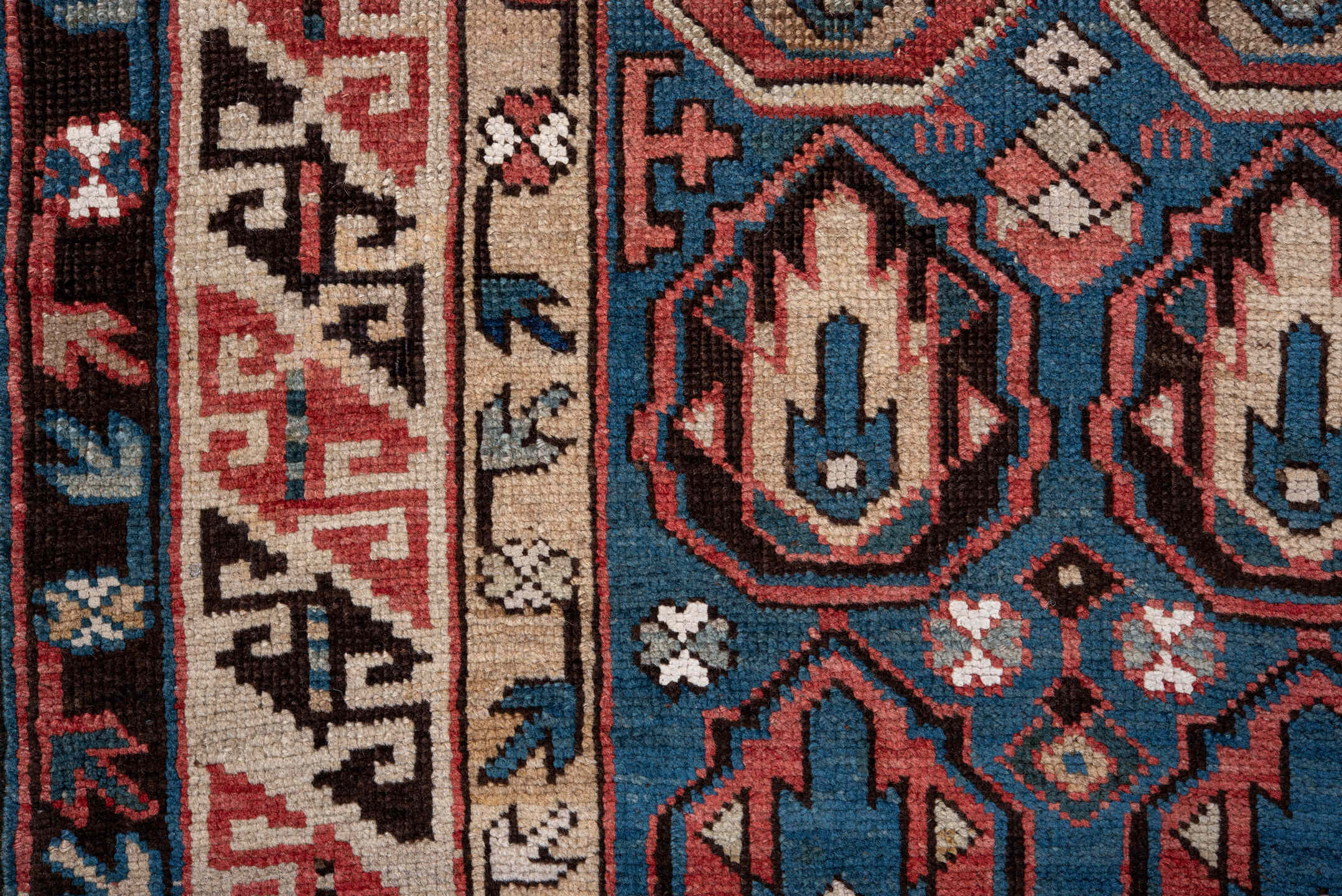 2' x 4' one-of-a-kind handmade vintage Caucasian small size rug. Color palette: blue, ivory, rust, brown, navy, pink, black