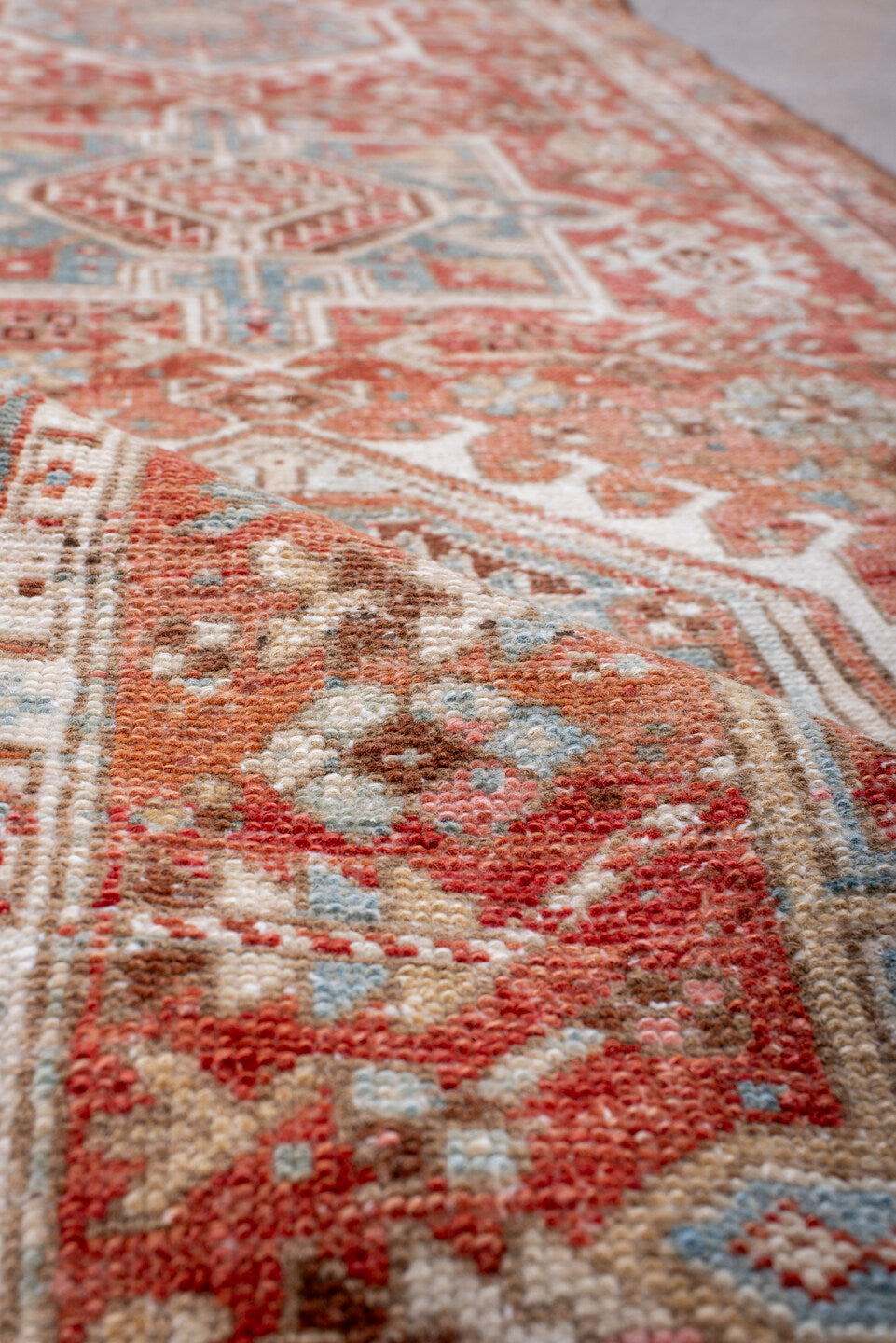 2' x 10' one-of-a-kind handmade antique Karaje runner rug. Color palette: rust, ivory, sky_blue, terra_cotta, camel, slate