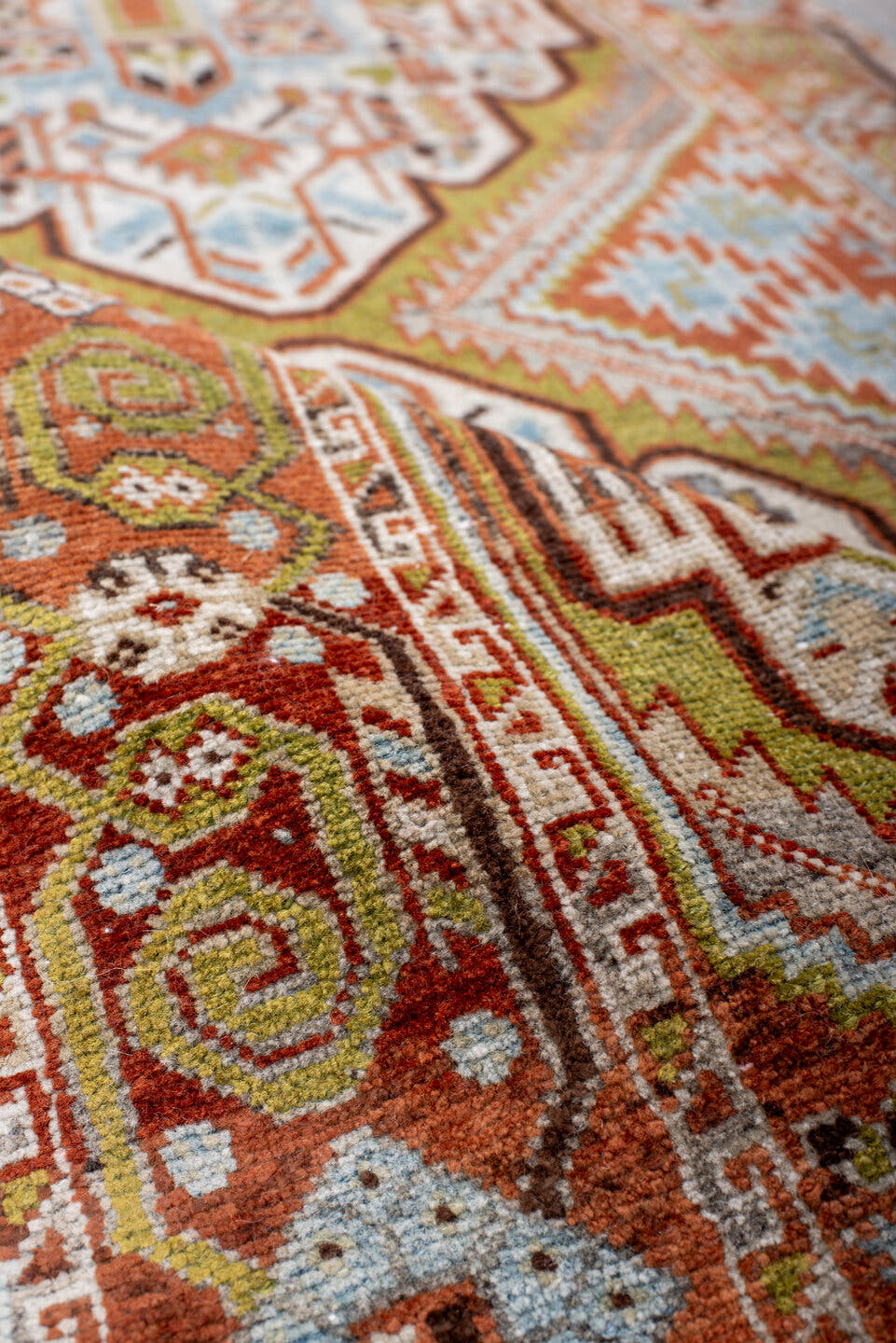 2' x 6' one-of-a-kind handmade vintage Afshar runner rug. Color palette: terra cotta, ivory, sky blue, olive, rust, charcoal