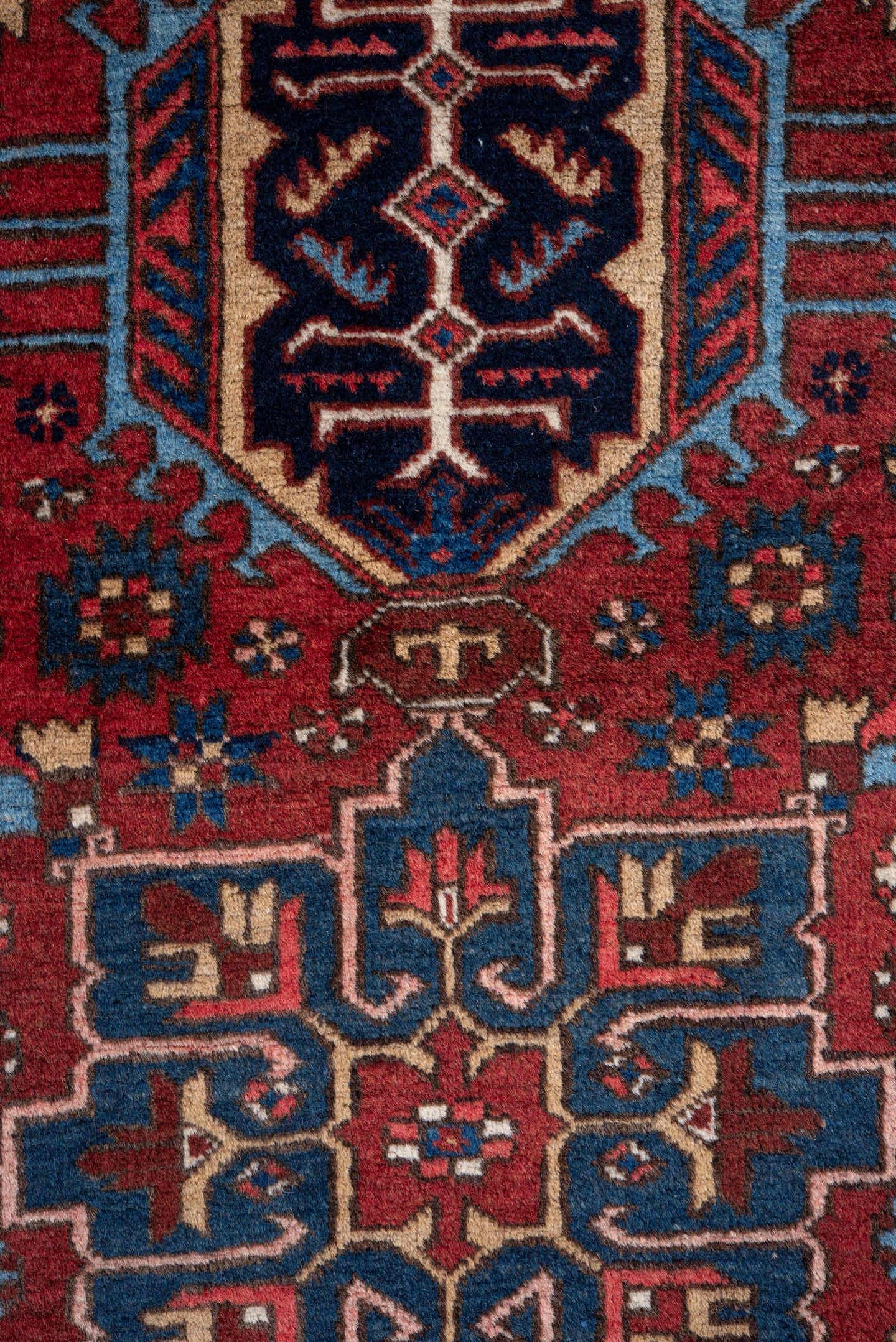 2' x 11' one-of-a-kind handmade vintage Heriz runner rug. Color palette: red, navy, ivory, sky blue, rust, camel, charcoal