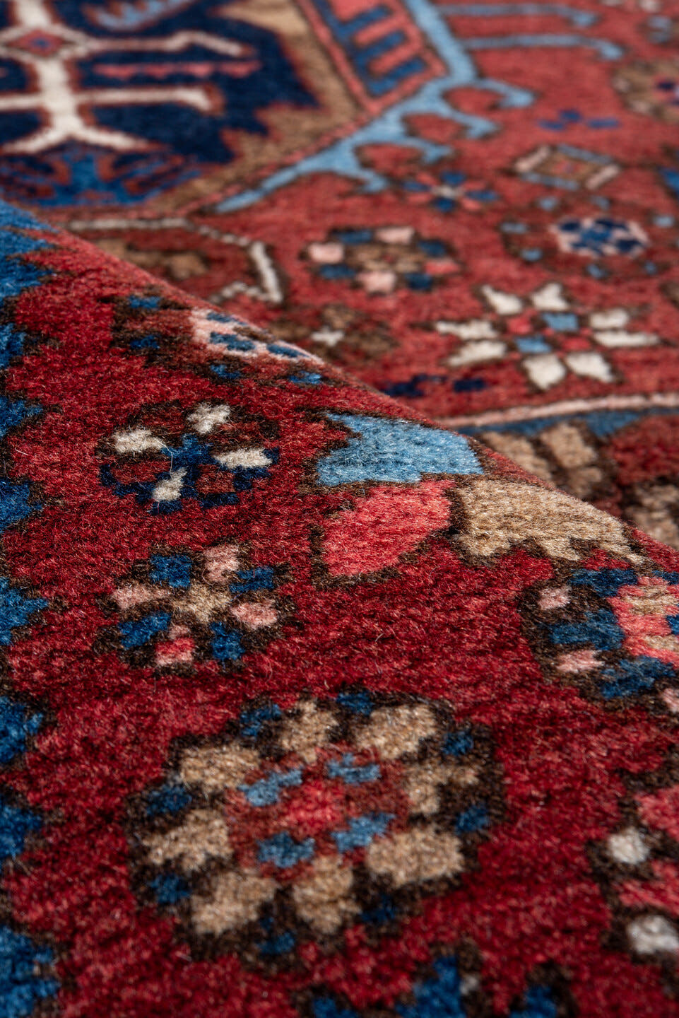 2' x 11' one-of-a-kind handmade vintage Heriz runner rug. Color palette: red, navy, ivory, sky blue, rust, camel, charcoal