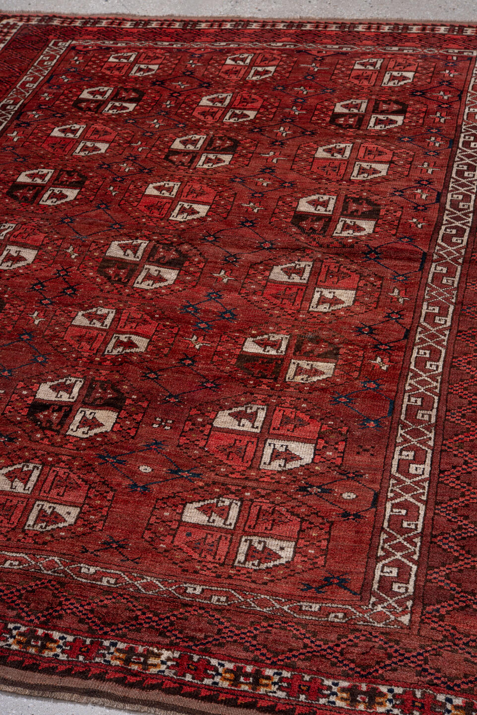 5' x 7' one-of-a-kind handmade vintage Afghan rug. Color palette: red, burgundy, ivory, brown, charcoal, navy, gray, black