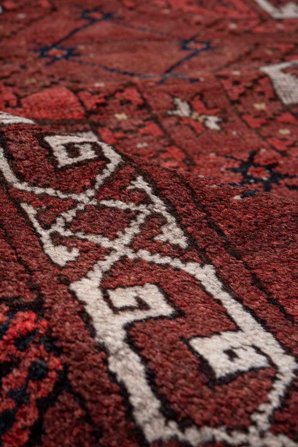 5' x 7' one-of-a-kind handmade vintage Afghan rug. Color palette: red, burgundy, ivory, brown, charcoal, navy, gray, black