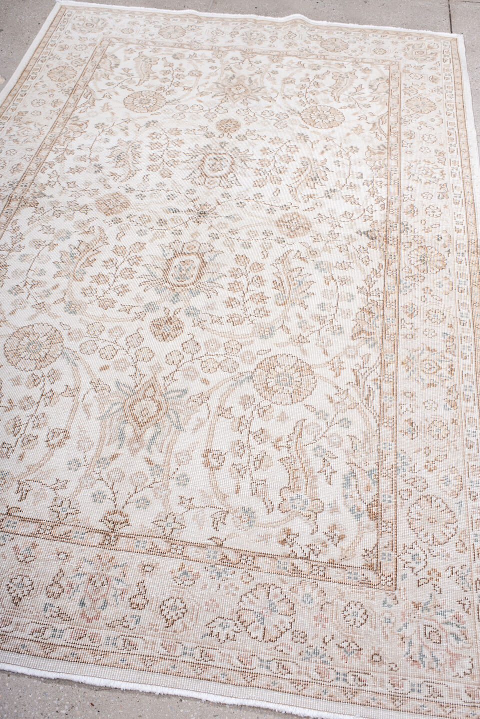 5' x 7' one-of-a-kind handmade antique Sparta rug. Color palette: ivory, beige, taupe, camel, pale blue, sand, gray