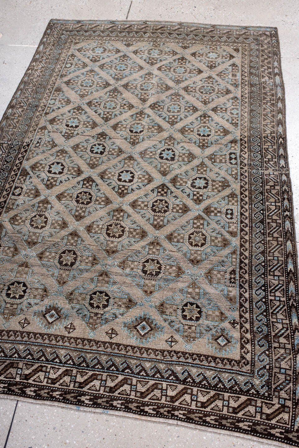 3' x 5' one-of-a-kind handmade antique Belouch small size rug. Color palette: brown, camel, ivory, sky blue, taupe, charcoal
