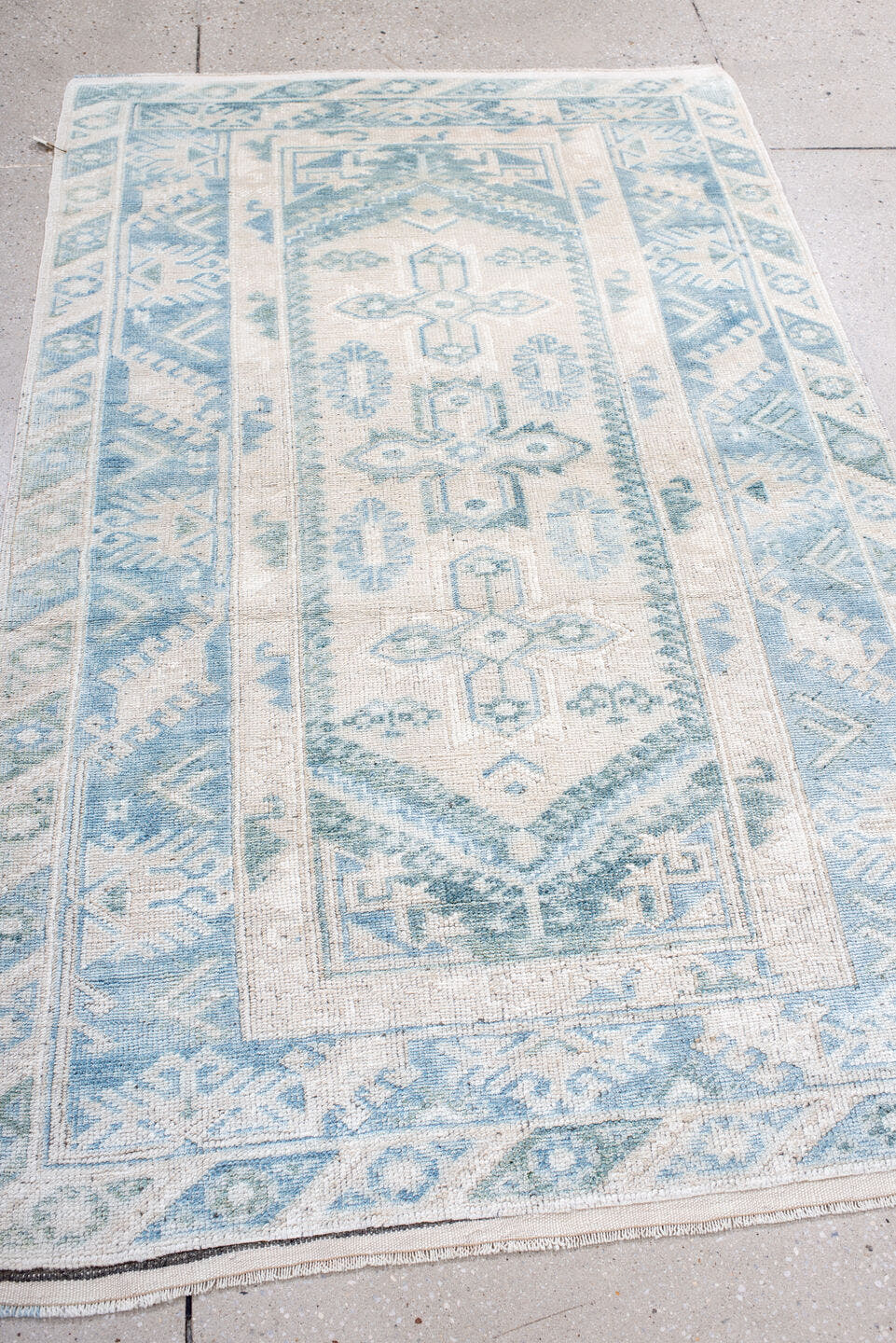 3' x 6' one-of-a-kind handmade antique Anatolian small size rug. Color palette: ivory, sky blue, pale blue, cream, aqua
