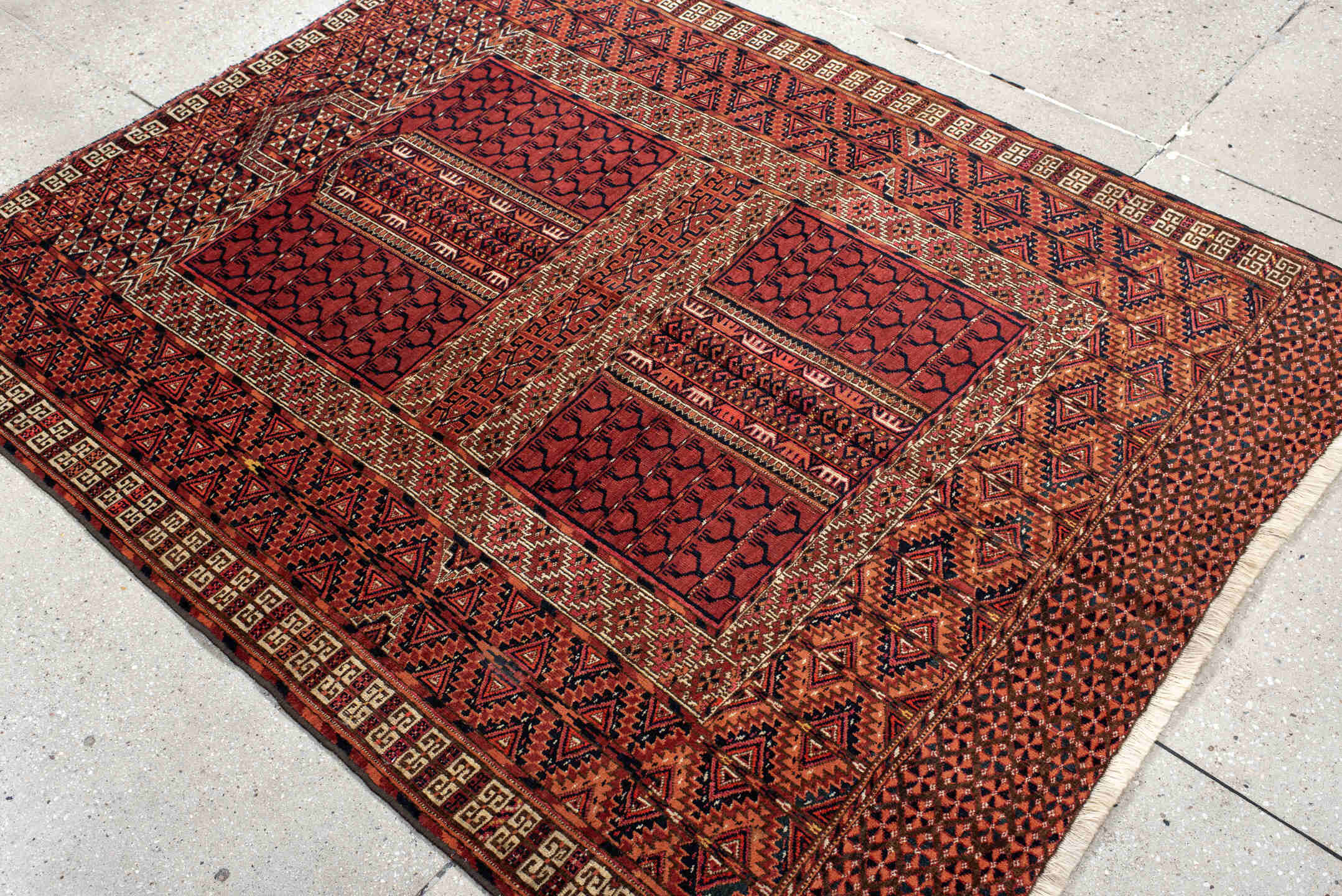 4' x 5' one-of-a-kind handmade antique Torkaman small size rug. Color palette: rust, crimson, ivory, black, terra cotta