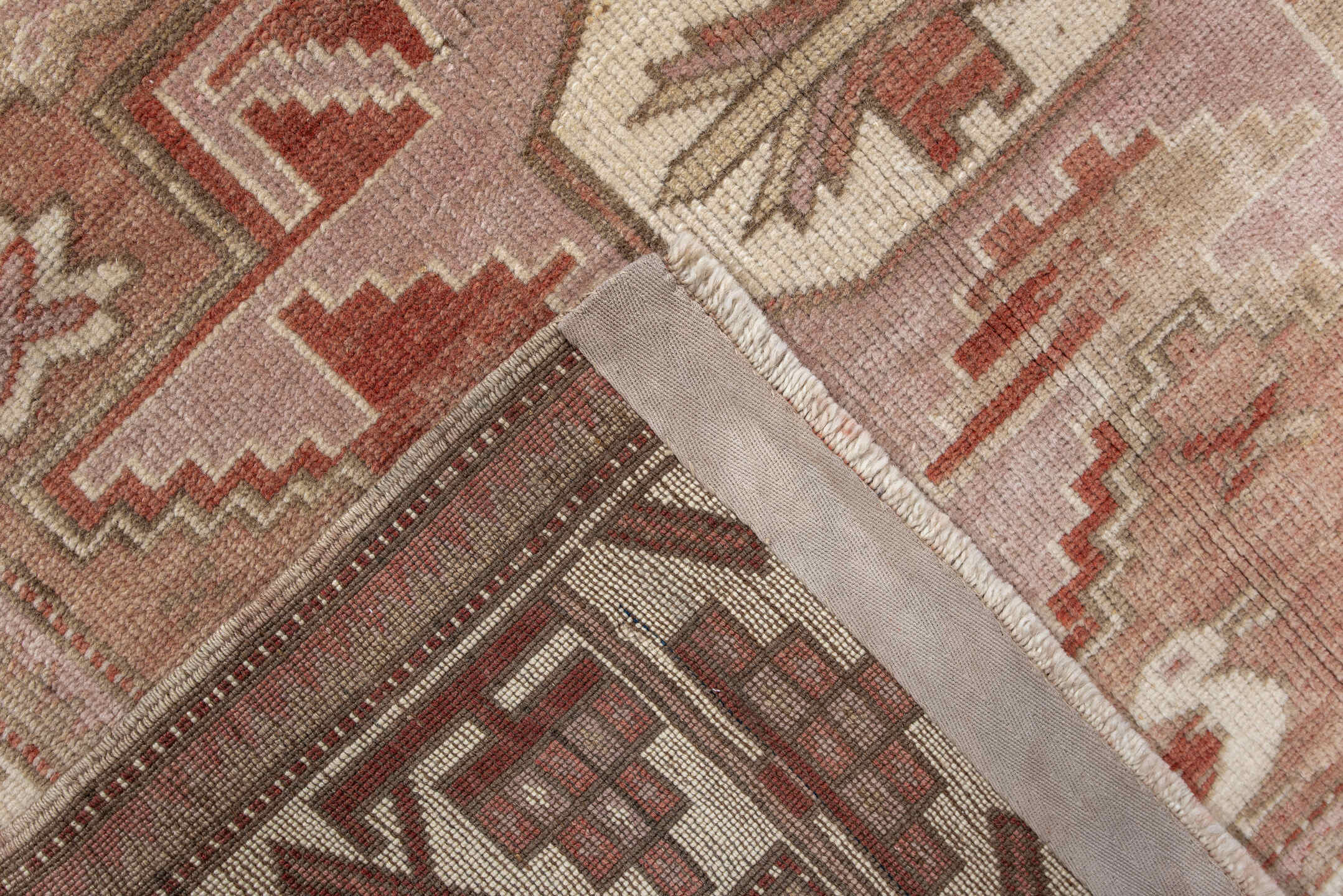 3' x 6' one-of-a-kind handmade vintage Anatolian small size rug. Color palette: brown, light gray, off-white, orange, pink