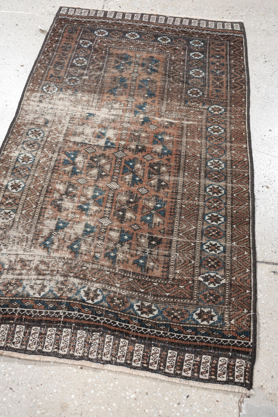 2' x 4' one-of-a-kind handmade antique Belouch small size rug. Color palette: rust, indigo, ivory, charcoal, camel, taupe