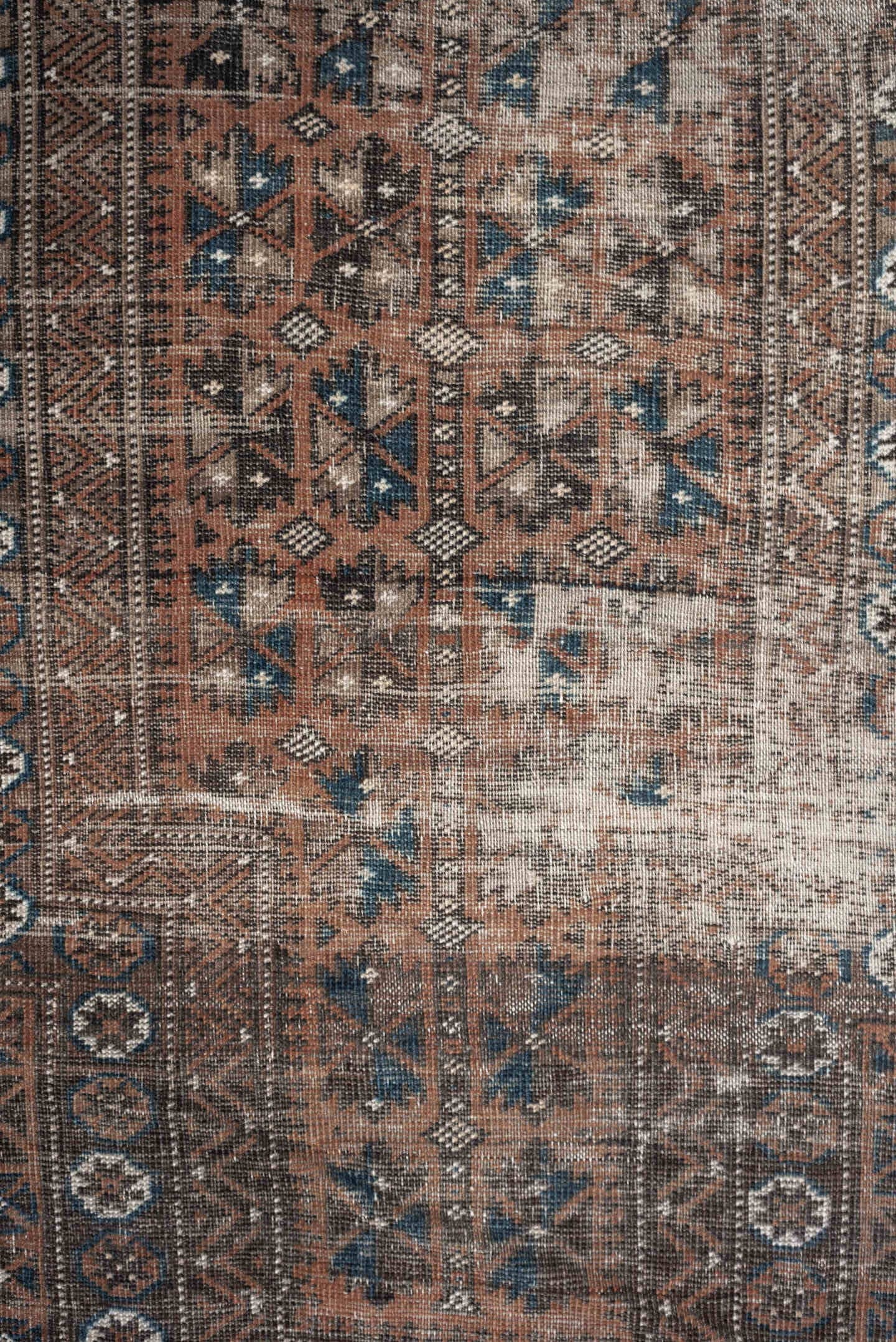 2' x 4' one-of-a-kind handmade antique Belouch small size rug. Color palette: rust, indigo, ivory, charcoal, camel, taupe