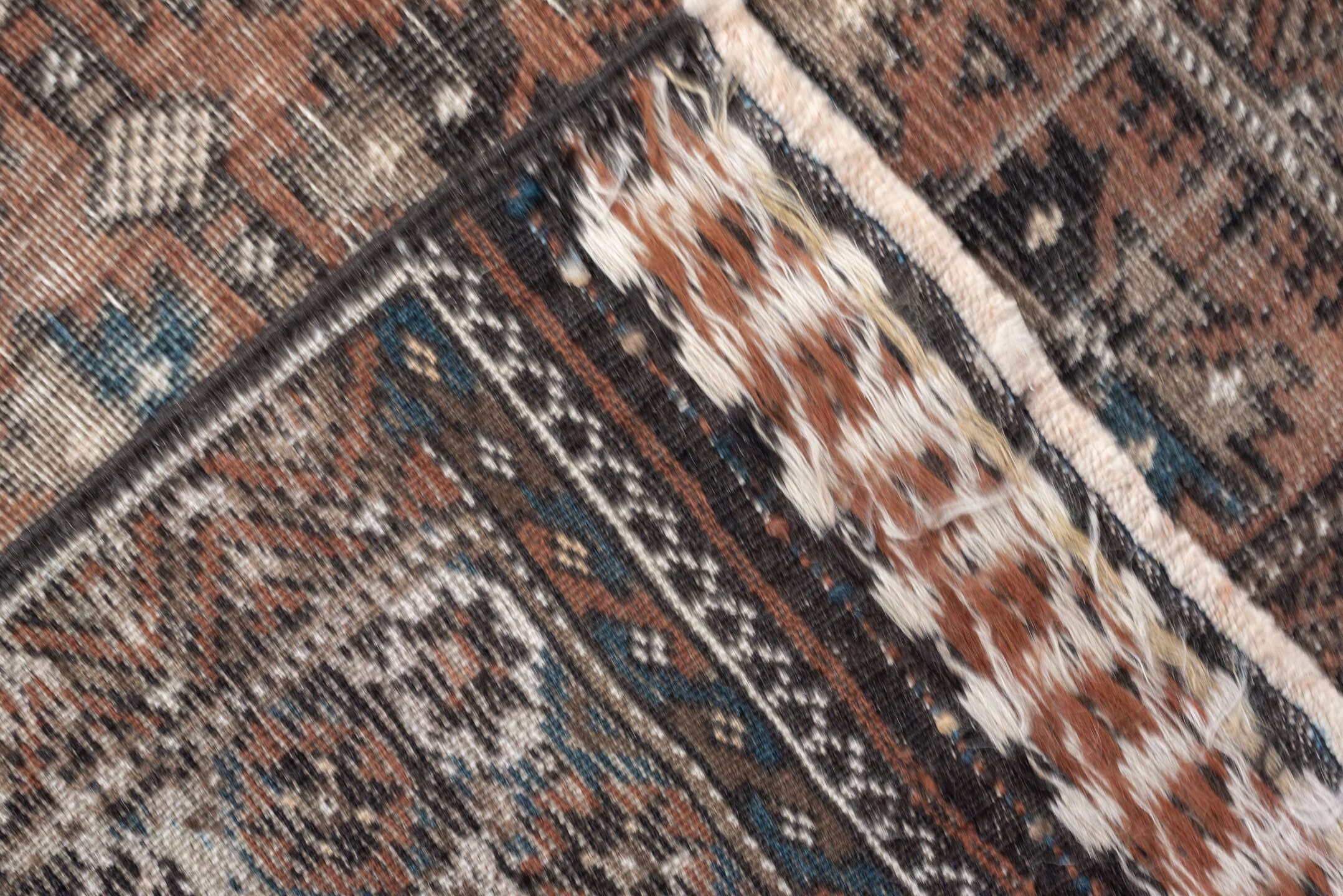 2' x 4' one-of-a-kind handmade antique Belouch small size rug. Color palette: rust, indigo, ivory, charcoal, camel, taupe