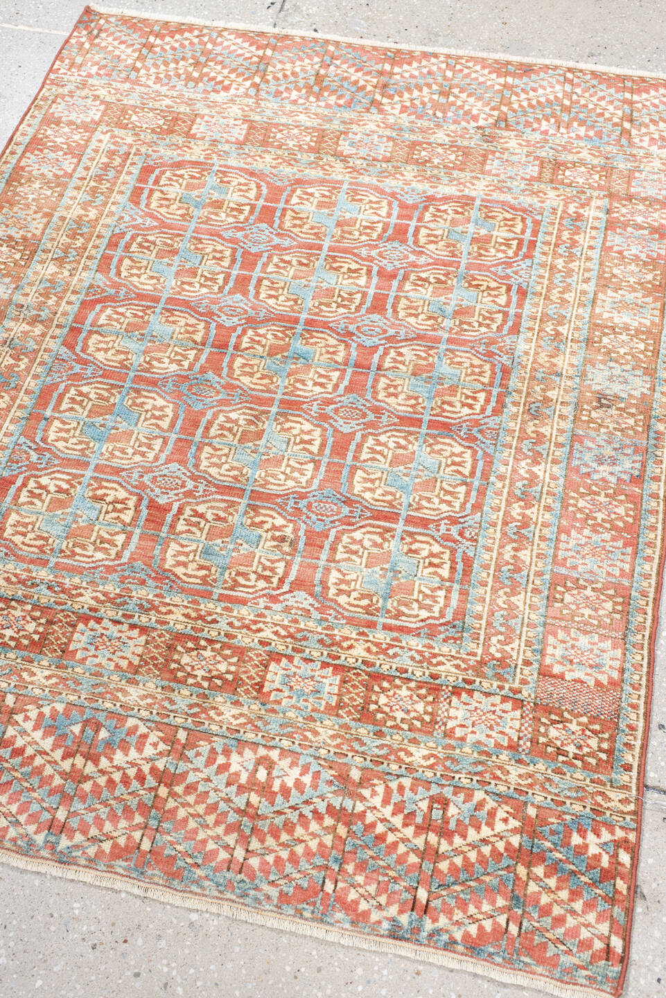 3' x 4' one-of-a-kind handmade antique Bokara small size rug. Color palette: coral, ivory, sky_blue, rust, camel, terracotta