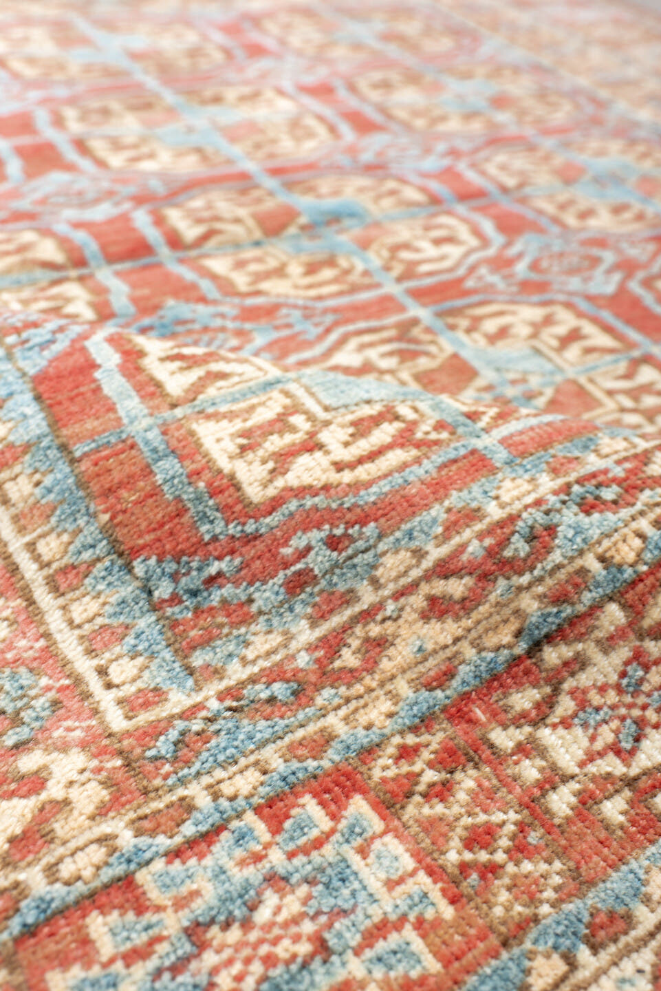 3' x 4' one-of-a-kind handmade antique Bokara small size rug. Color palette: coral, ivory, sky_blue, rust, camel, terracotta