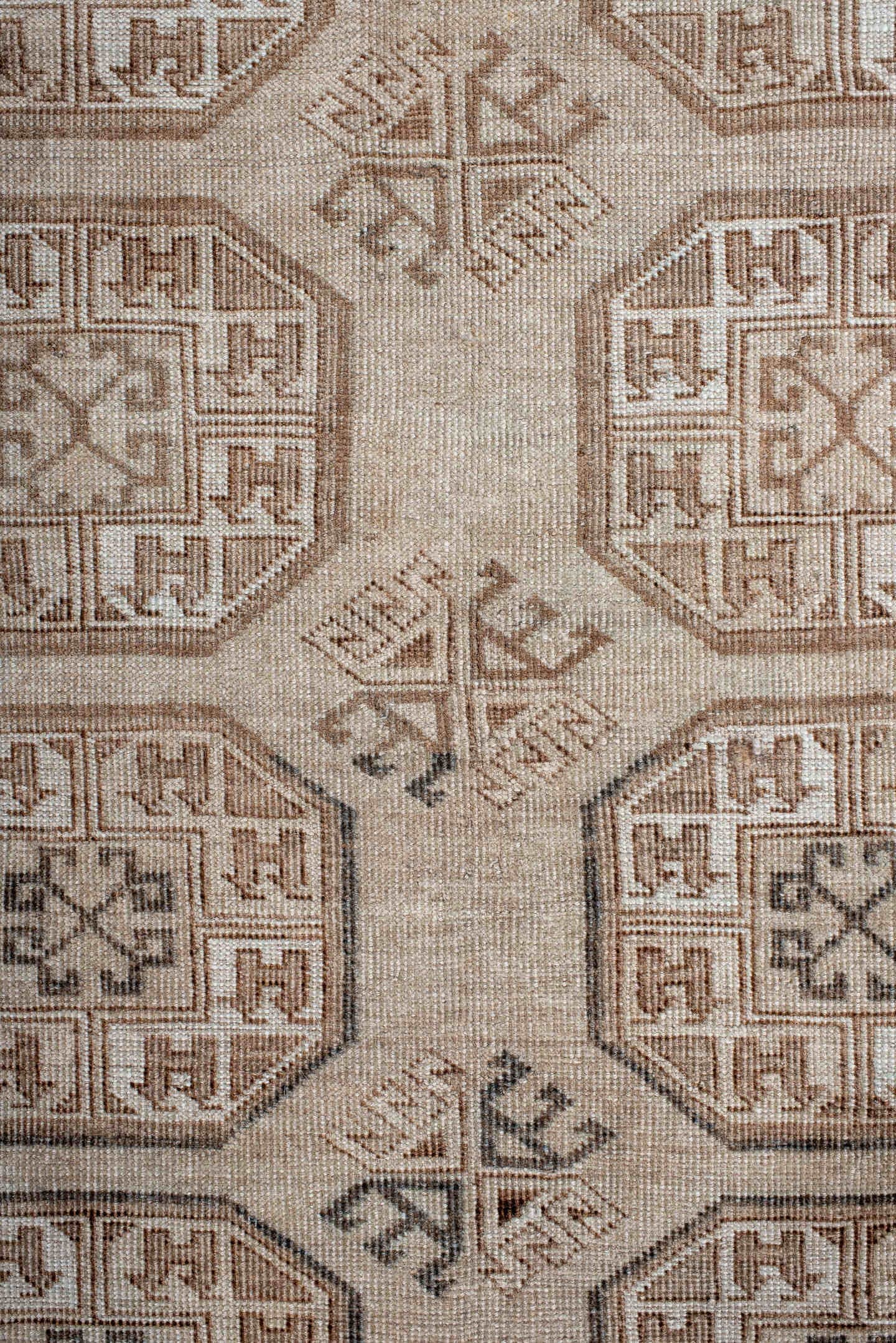 5' x 7' one-of-a-kind handmade antique Afghan rug. Color palette: ivory, taupe, camel, brown, charcoal, beige, gray, black