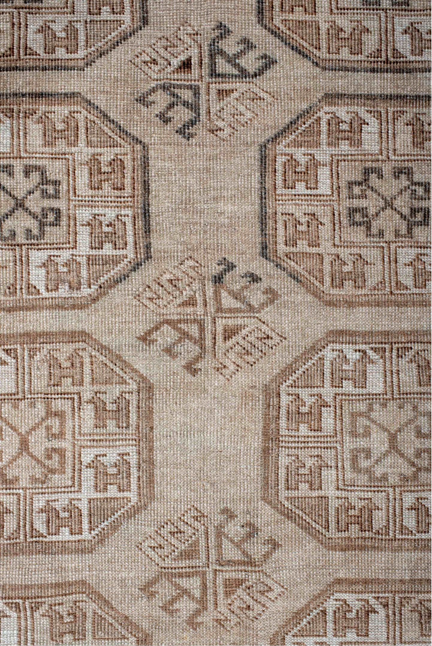 5' x 7' one-of-a-kind handmade vintage Afghan rug. Color palette: black, brown, gray, light gray, off-white, pink, silver