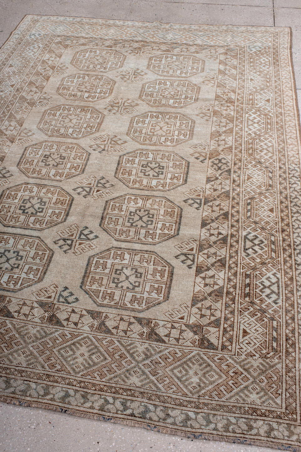 5' x 7' one-of-a-kind handmade antique Afghan rug. Color palette: ivory, taupe, camel, brown, charcoal, beige, gray, black