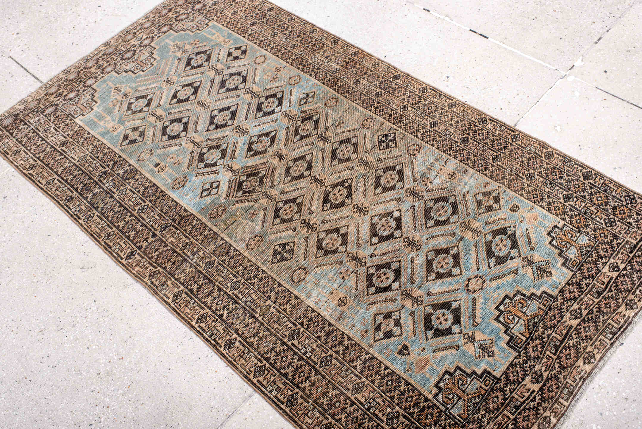 3' x 5' one-of-a-kind handmade antique Belouch small size rug. Color palette: sky blue, ivory, charcoal, taupe, camel, brown