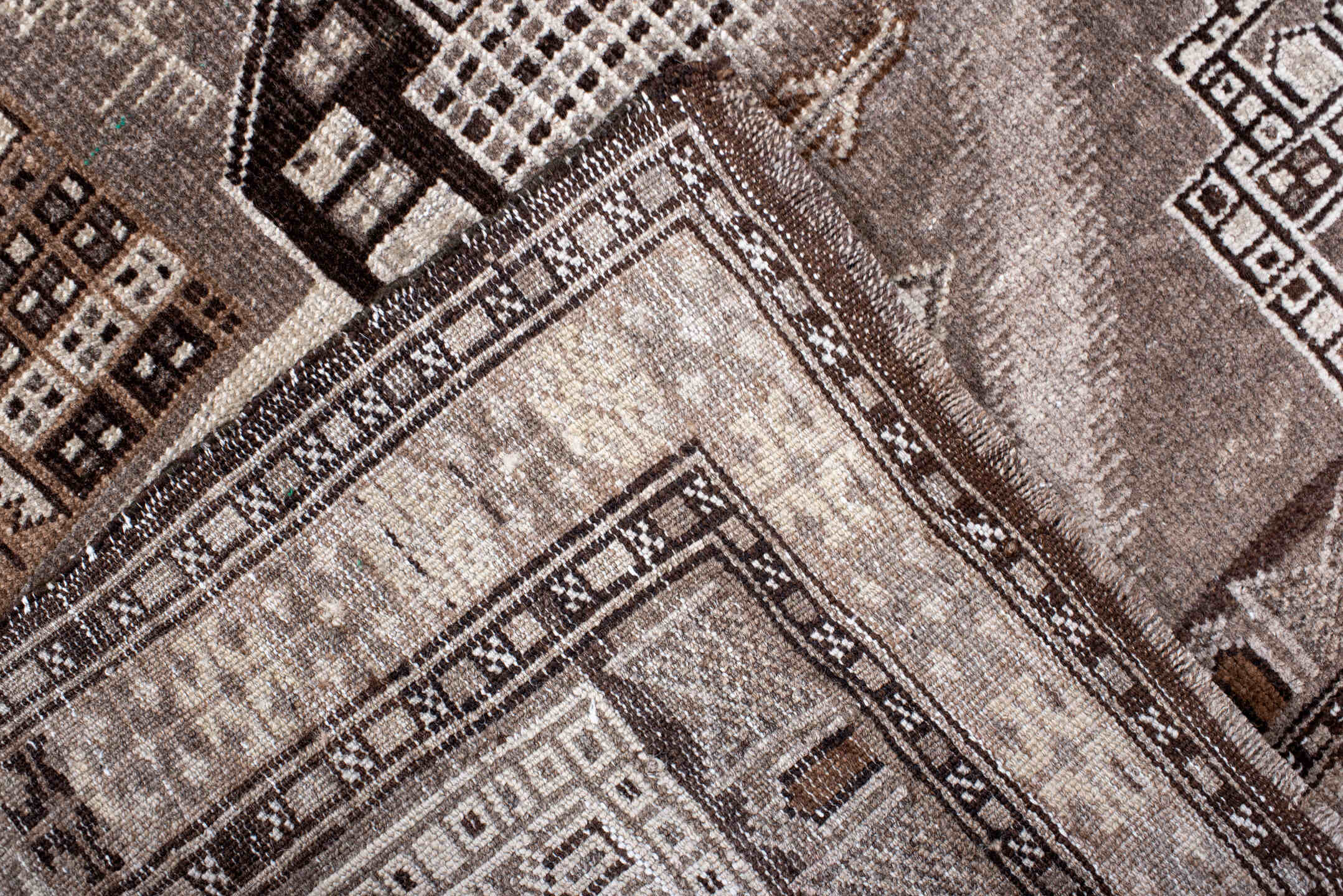 2' x 4' one-of-a-kind handmade vintage Belouch small size rug. Color palette: black, brown, charcoal, gray, light gray