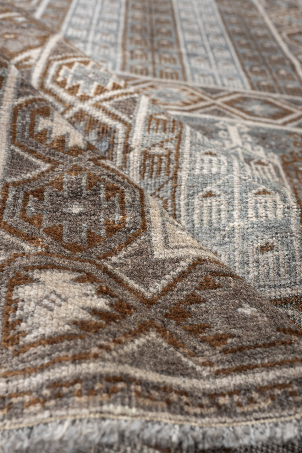 3' x 4' one-of-a-kind handmade antique Belouch small size rug. Color palette: camel, taupe, ivory, brown, gray, blue gray