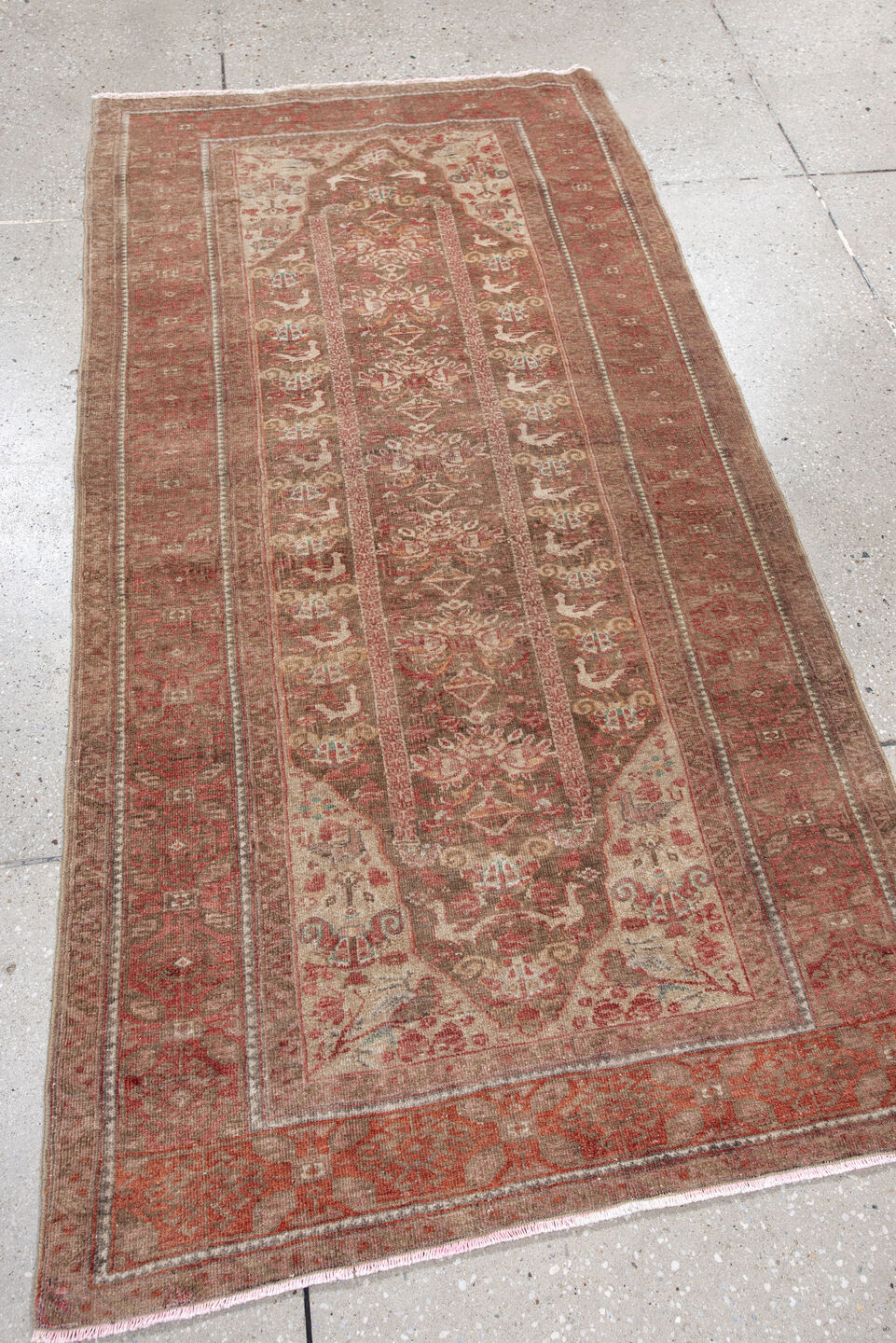 2' x 5' one-of-a-kind handmade vintage Belouch small size rug. Color palette: brown, red, pink, gray