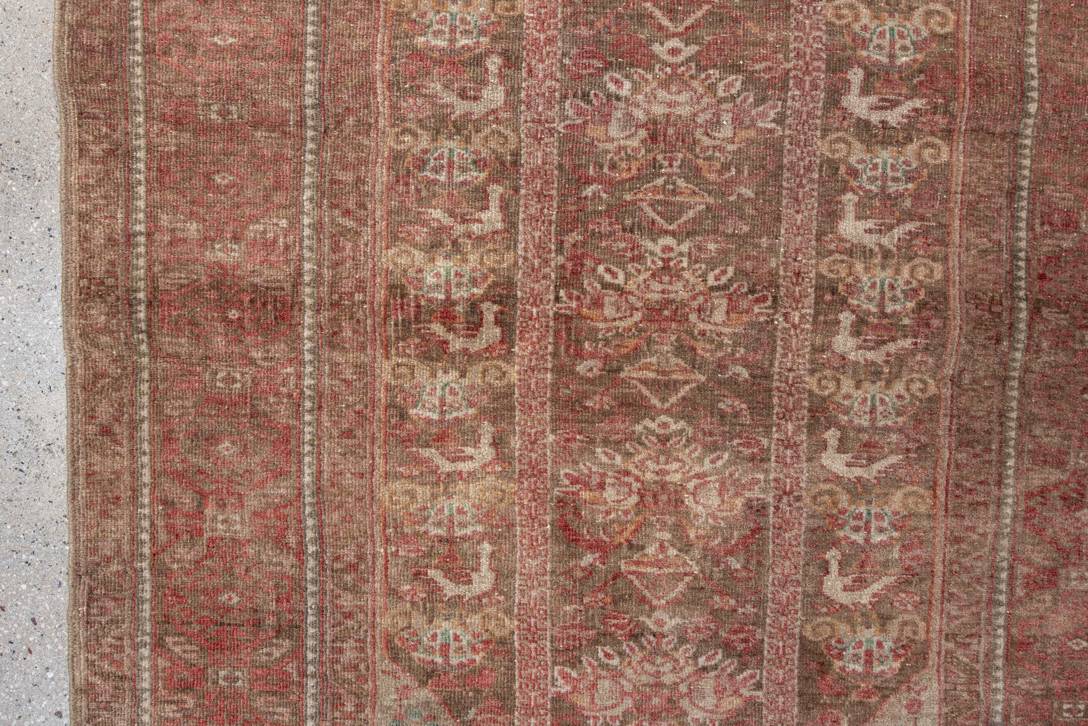 2' x 5' one-of-a-kind handmade vintage Belouch small size rug. Color palette: brown, red, pink, gray