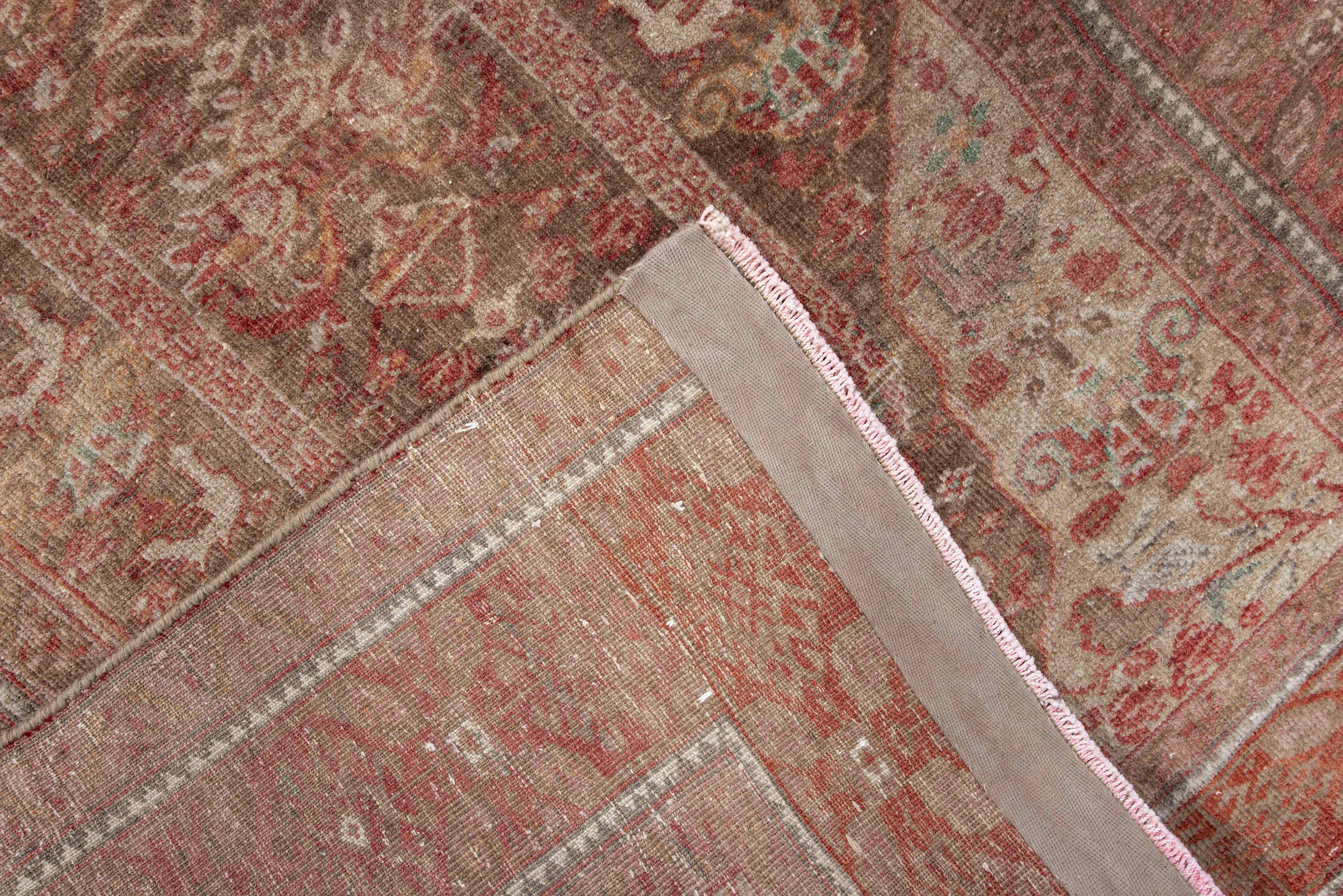 2' x 5' one-of-a-kind handmade antique Belouch small size rug. Color palette: rust, ivory, taupe, rose, sage, brown
