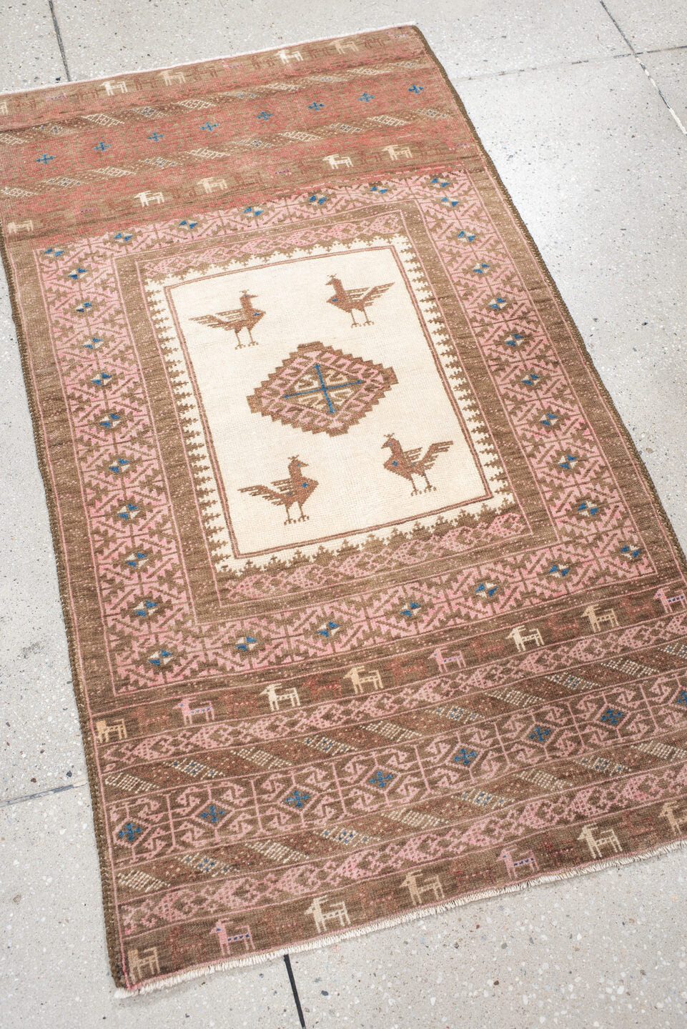 2' x 4' one-of-a-kind handmade vintage Belouch small size rug. Color palette: brown, gray, blue, pink, orange, off-white