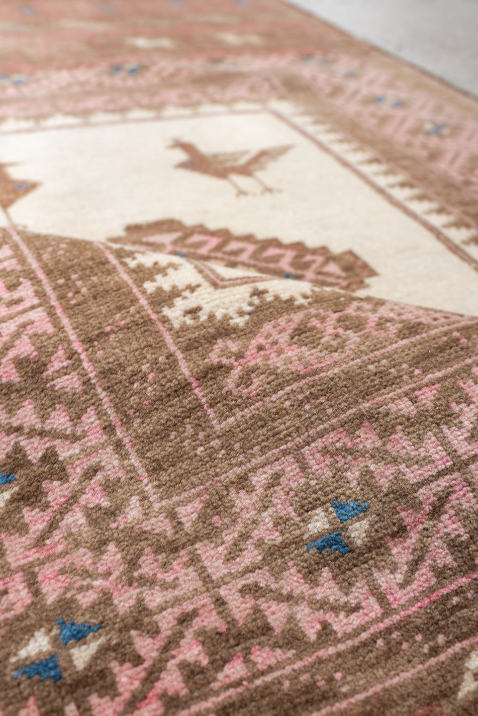 2' x 4' one-of-a-kind handmade vintage Belouch small size rug. Color palette: brown, gray, blue, pink, orange, off-white