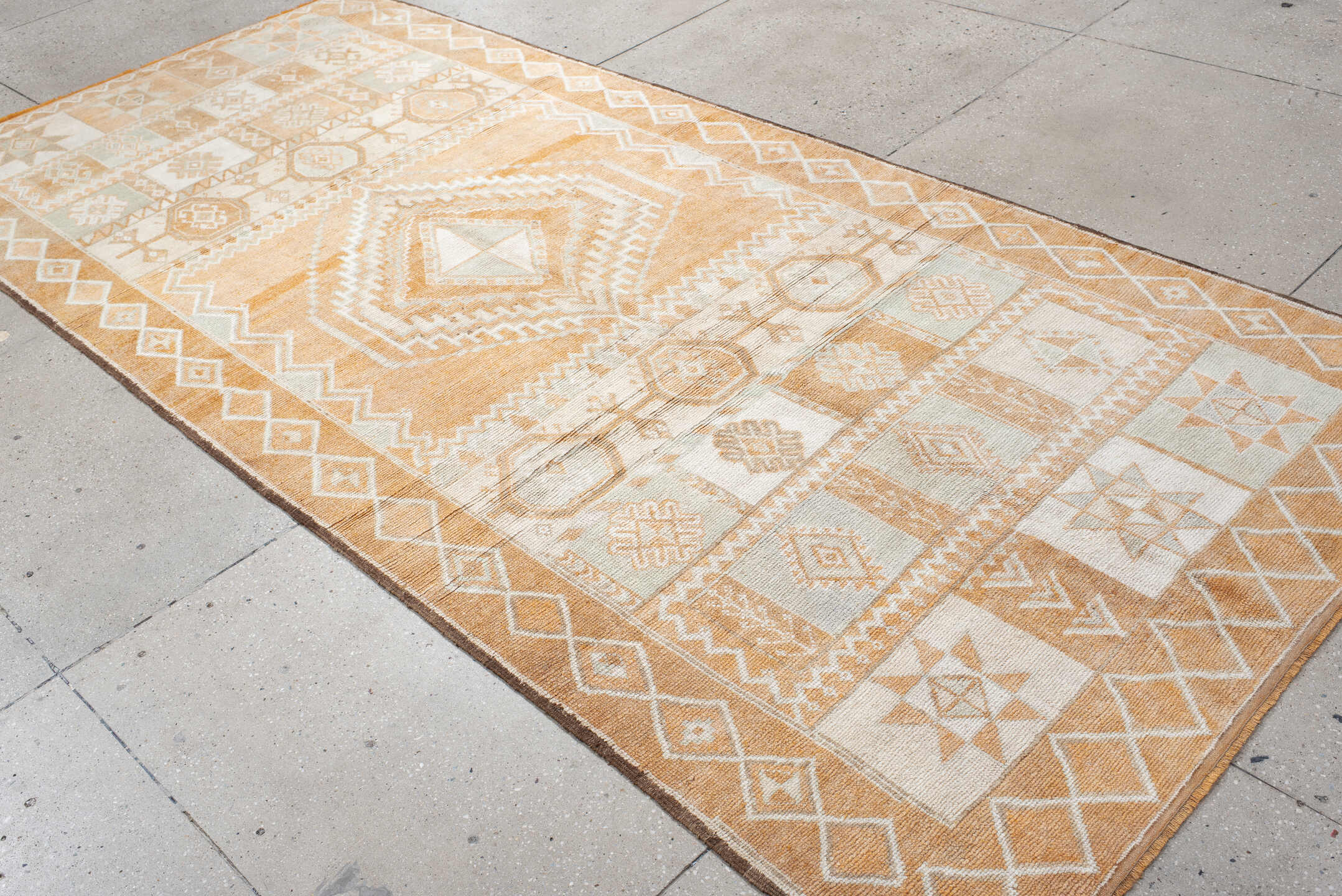 5' x 11' one-of-a-kind handmade antique Moroccan rug. Color palette: apricot, ivory, pale blue, sand, cream, terracotta