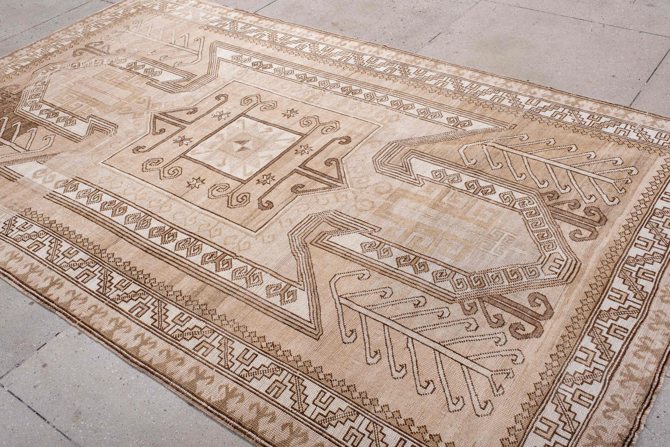 6' x 10' one-of-a-kind handmade antique Kars large size rug. Color palette: ivory, beige, taupe, camel, brown, blush, gray
