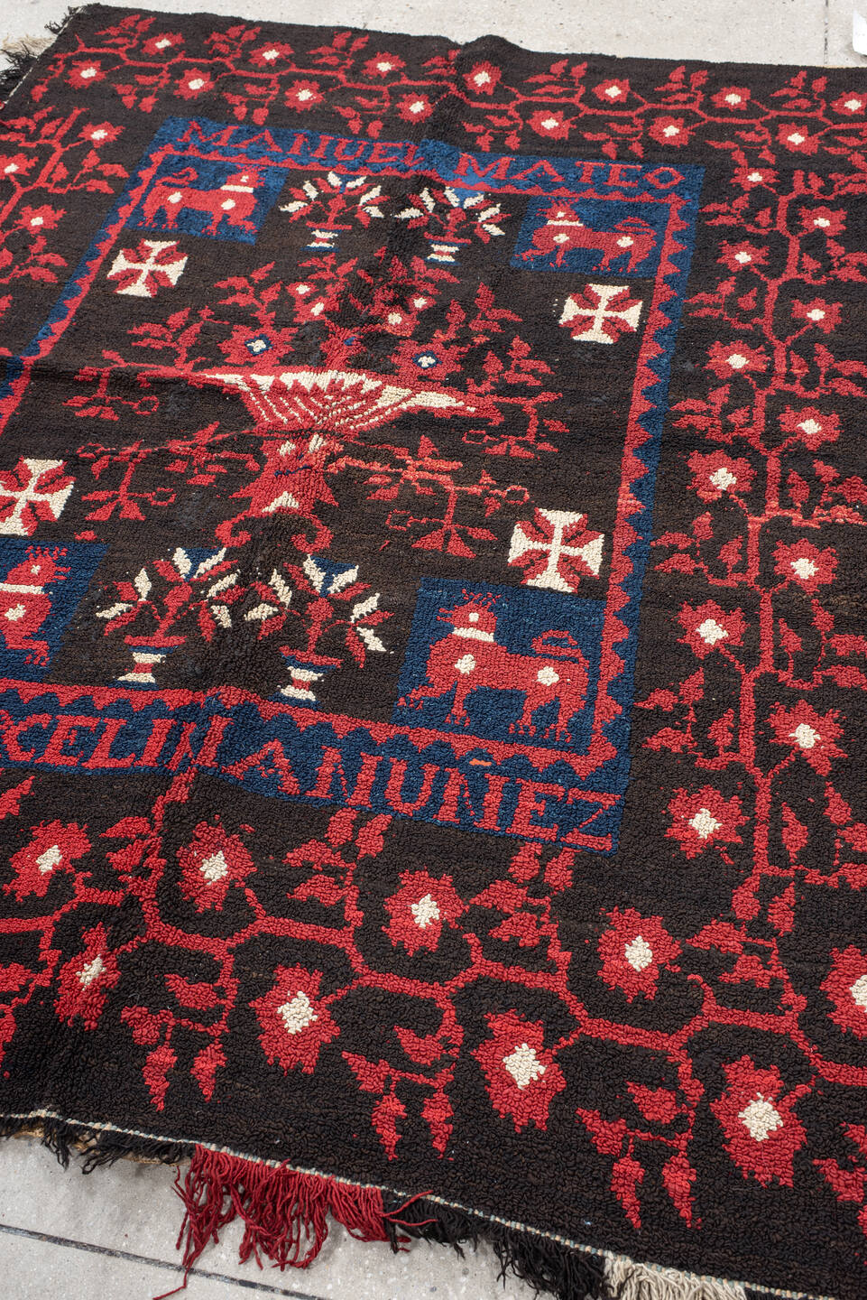 5' x 7' one-of-a-kind handmade vintage European rug. Color palette: black, blue, brown, charcoal, gray, off-white, pink, red