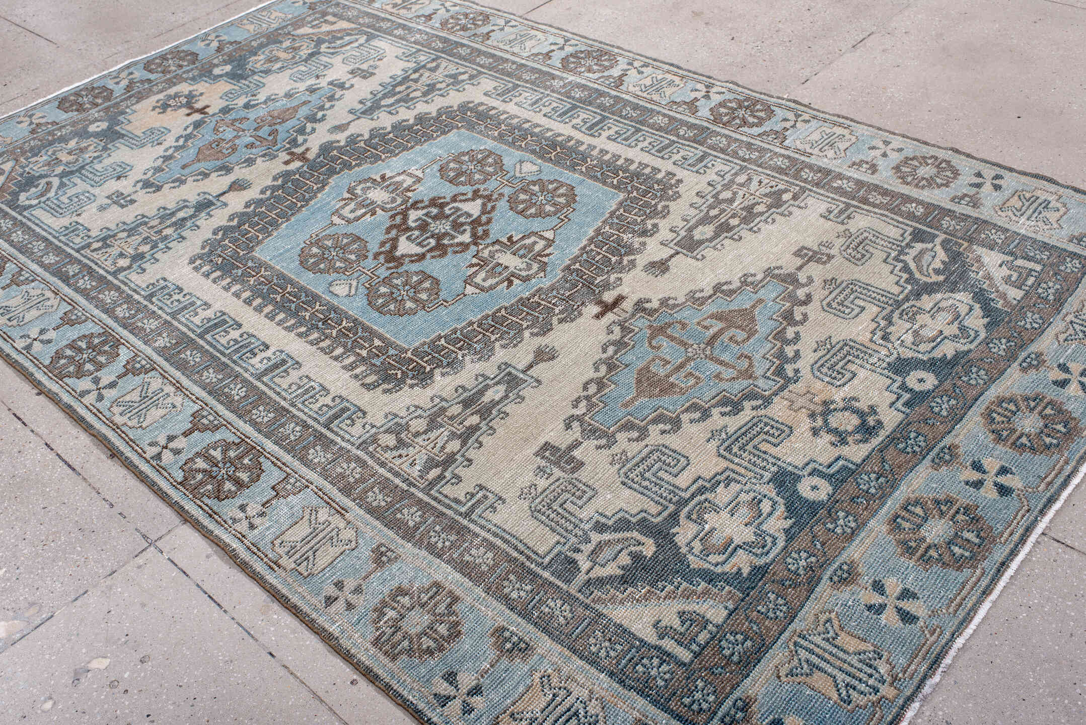 6' x 9' one-of-a-kind handmade antique Veece medium size rug. Color palette: ivory, sky blue, slate, taupe, brown, charcoal