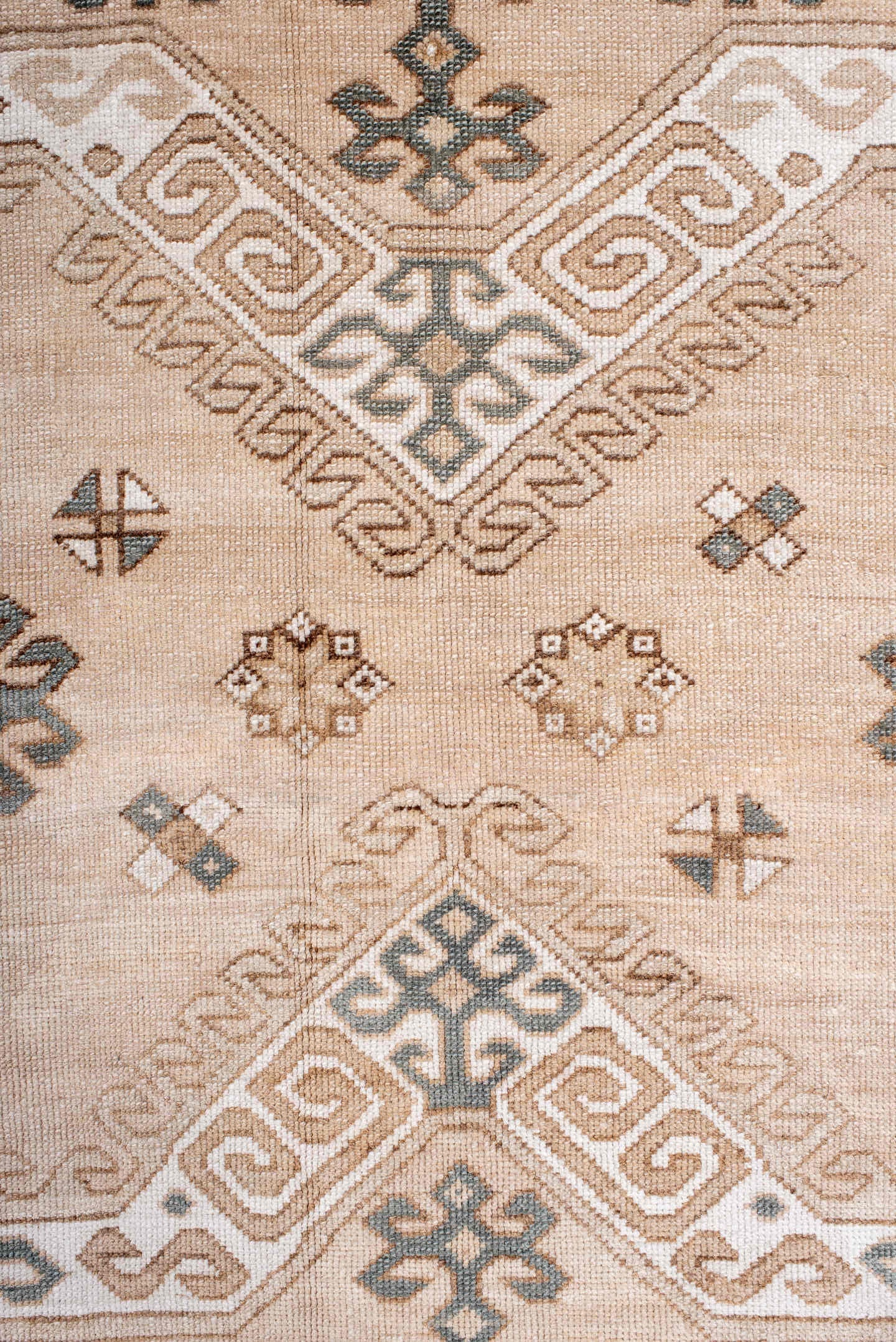 7' x 9' one-of-a-kind handmade antique Trans Caucasian rug. Color palette: ivory, camel, taupe, slate, sand, pewter, beige