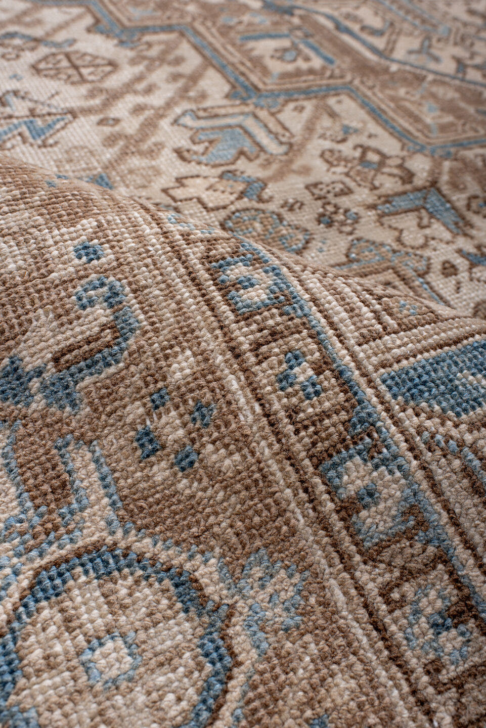 6' x 8' one-of-a-kind handmade antique Heriz medium size rug. Color palette: ivory, taupe, sky blue, camel, brown, beige
