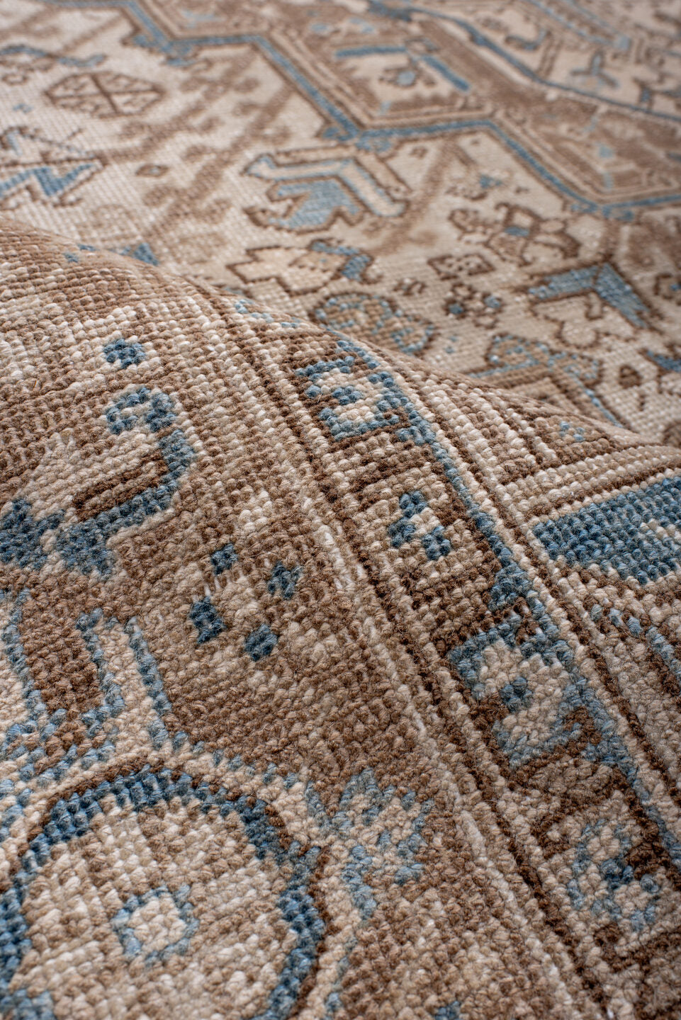 6' x 8' one-of-a-kind handmade antique Heriz medium size rug. Color palette: ivory, taupe, sky blue, camel, brown, beige