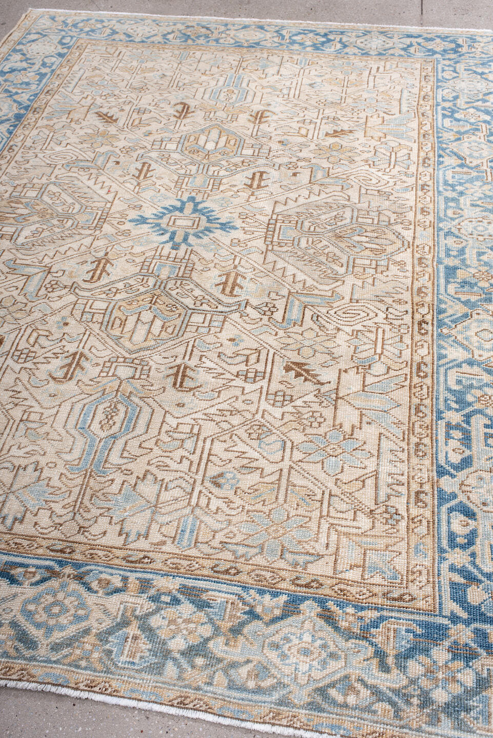 6' x 8' one-of-a-kind handmade antique Heriz medium size rug. Color palette: ivory, sky blue, camel, taupe, light brown