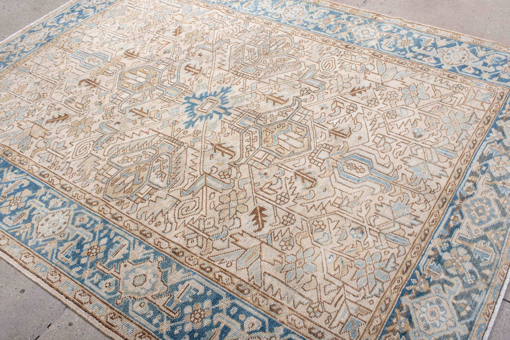 6' x 8' one-of-a-kind handmade antique Heriz medium size rug. Color palette: ivory, sky blue, camel, taupe, light brown