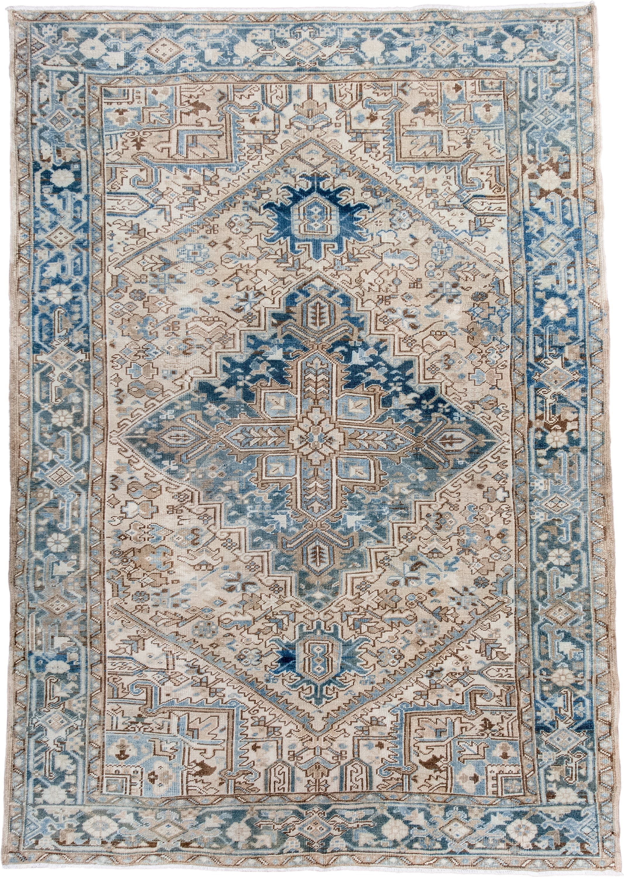 6' x 9' one-of-a-kind handmade antique Heriz medium size rug. Color palette: ivory, sky blue, denim blue, taupe, beige