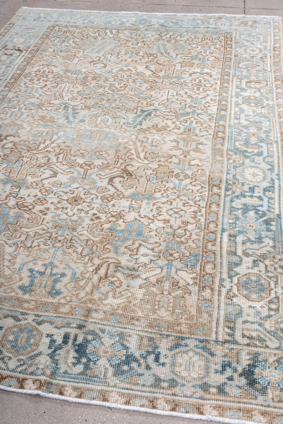 6' x 9' one-of-a-kind handmade antique Heriz medium size rug. Color palette: ivory, light blue, taupe, beige, camel