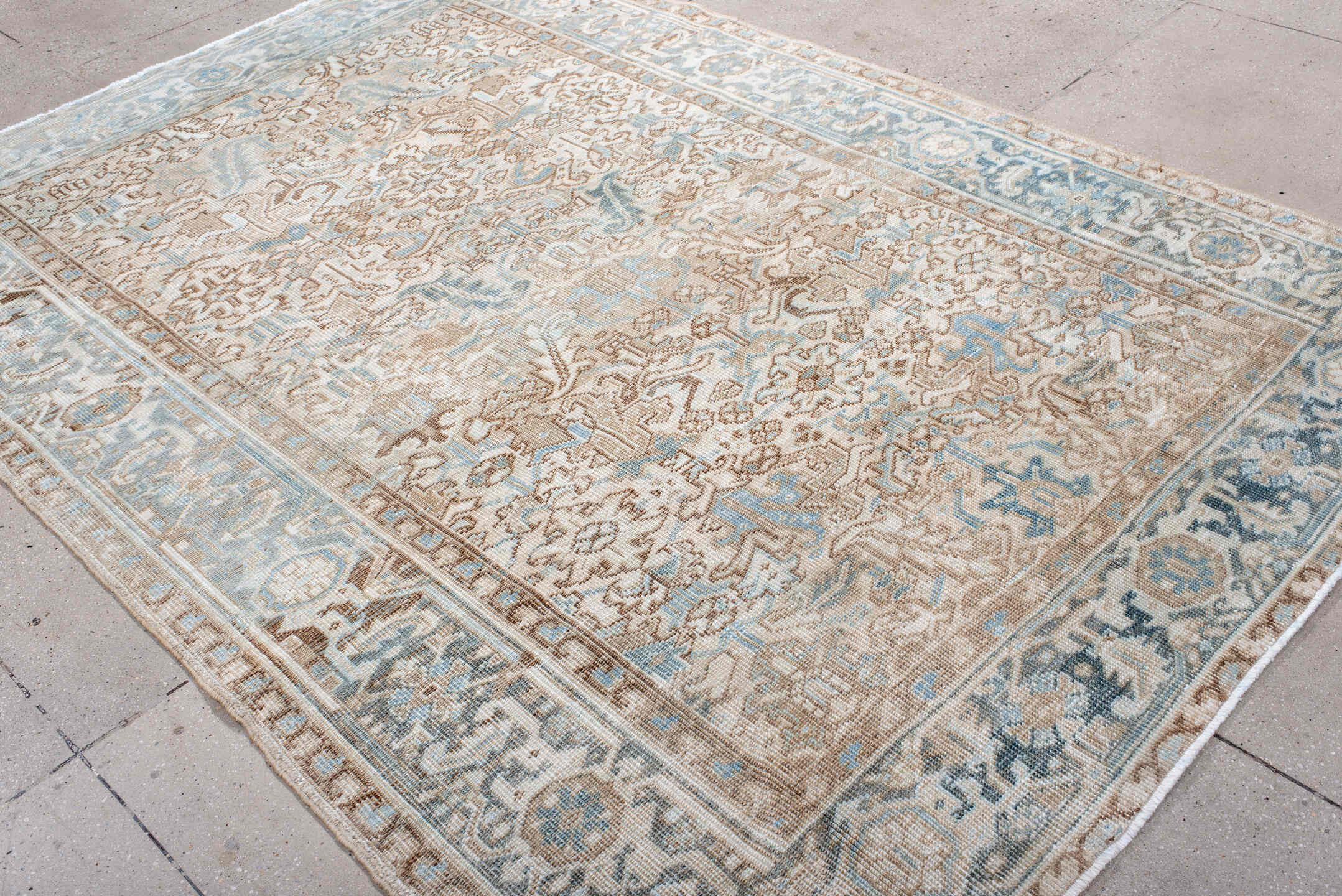 6' x 9' one-of-a-kind handmade antique Heriz medium size rug. Color palette: ivory, light blue, taupe, beige, camel