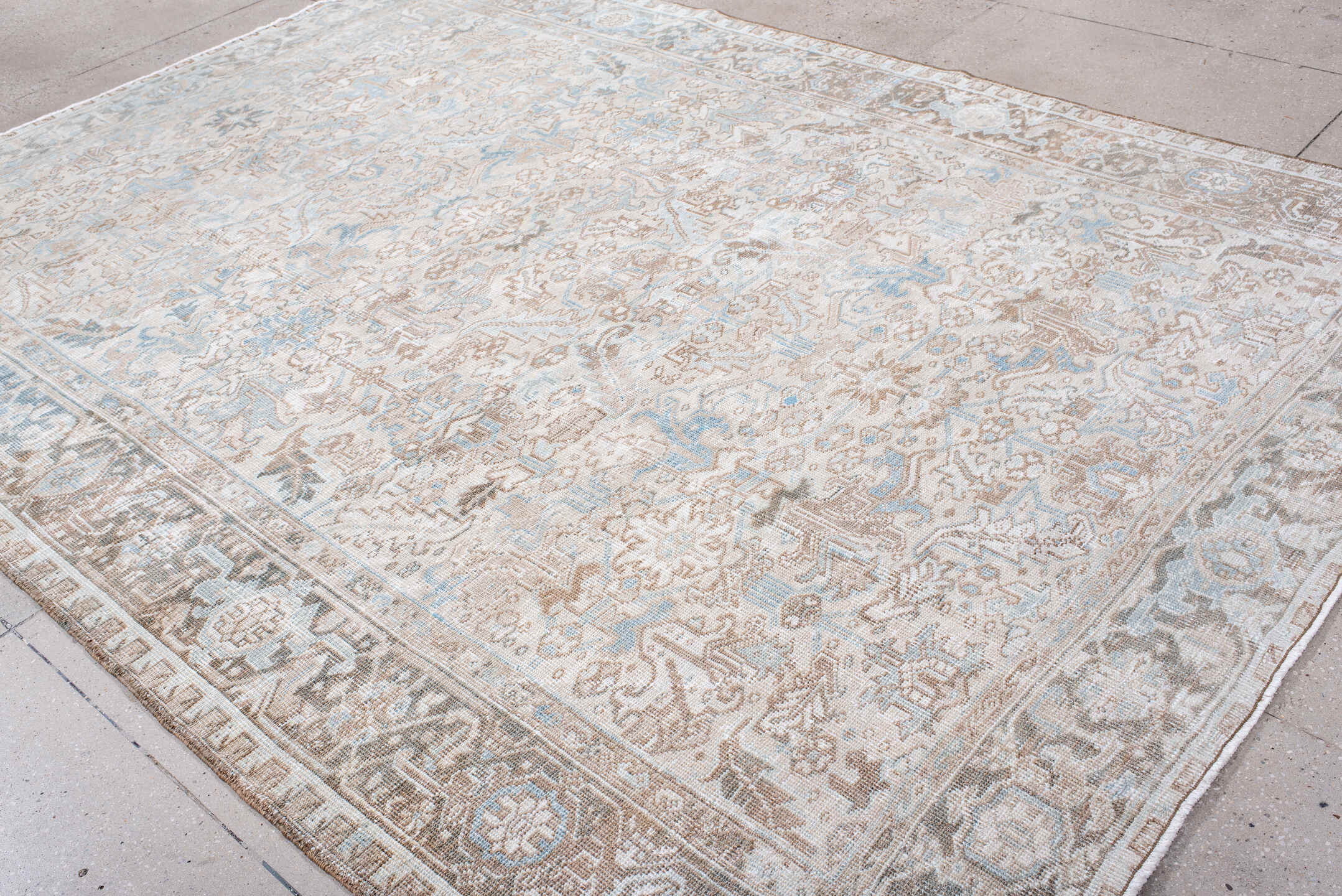 7' x 10' one-of-a-kind handmade antique Heriz large size rug. Color palette: ivory, taupe, powder_blue, beige, light_gray