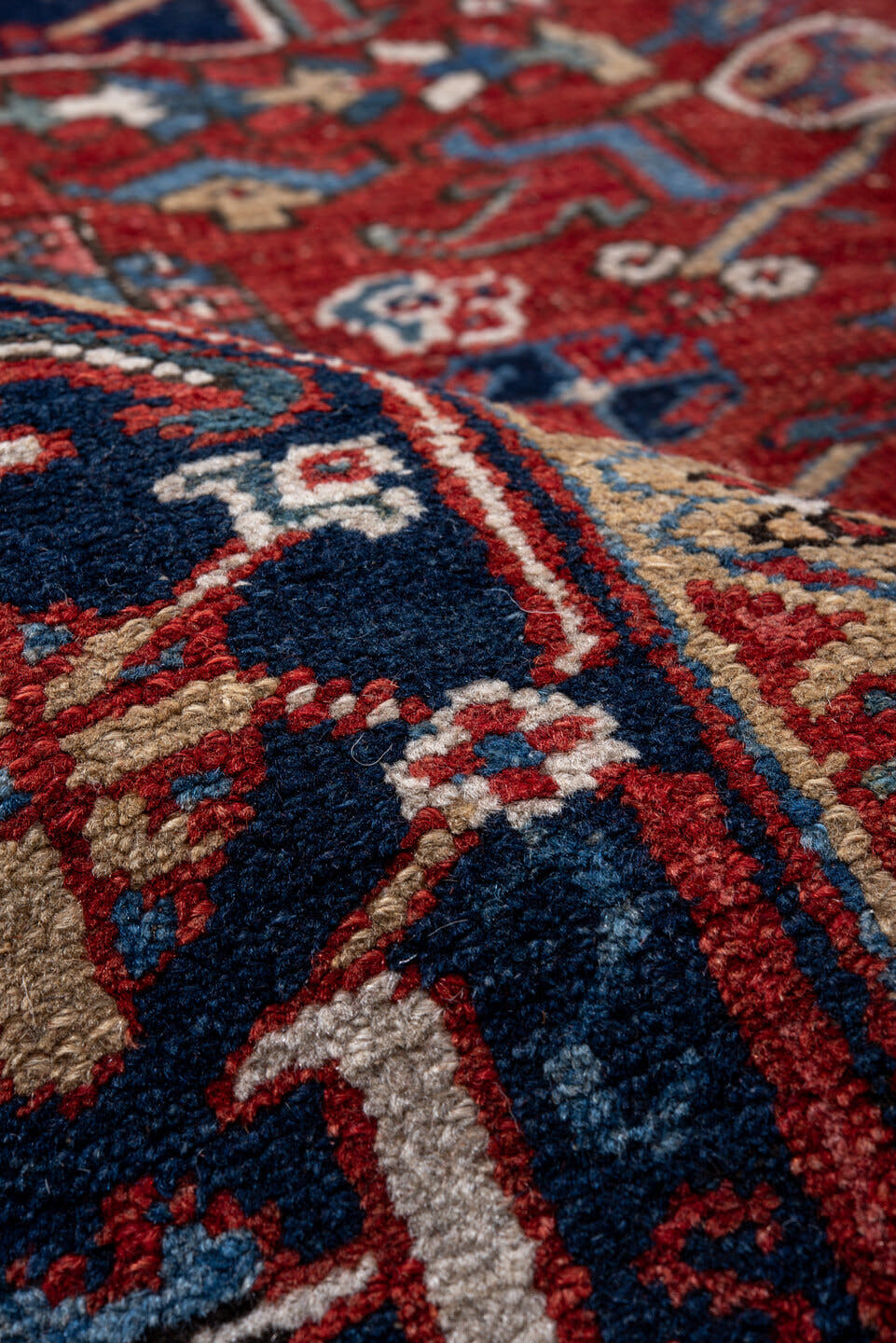 7' x 11' one-of-a-kind handmade vintage Heriz large size rug. Color palette: rust, navy, ivory, sky blue, camel, crimson