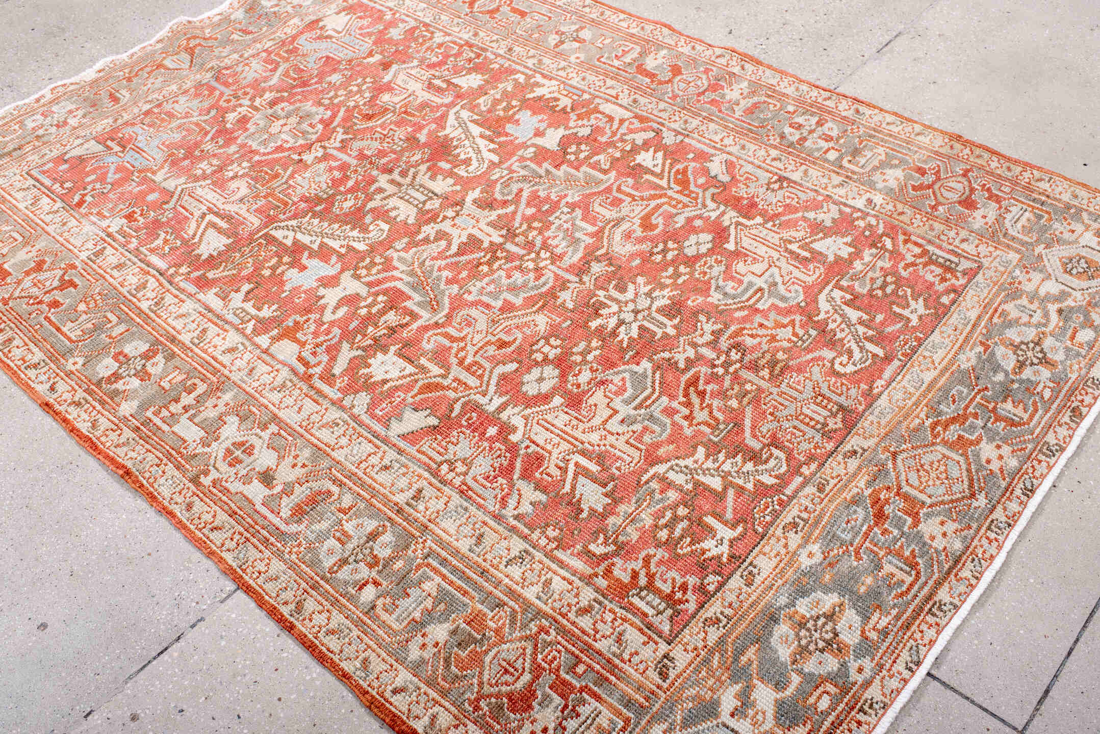 5' x 7' one-of-a-kind handmade vintage Heriz rug. Color palette: coral, ivory, taupe, terra cotta, camel, sage, terracotta