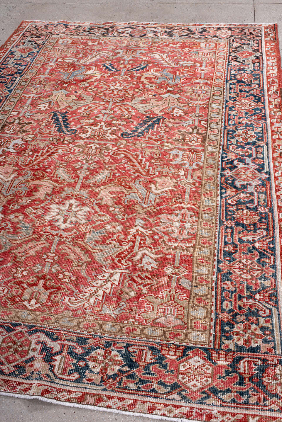 6' x 8' one-of-a-kind handmade antique Heriz medium size rug. Color palette: terra cotta, ivory, navy, soft blue, rust