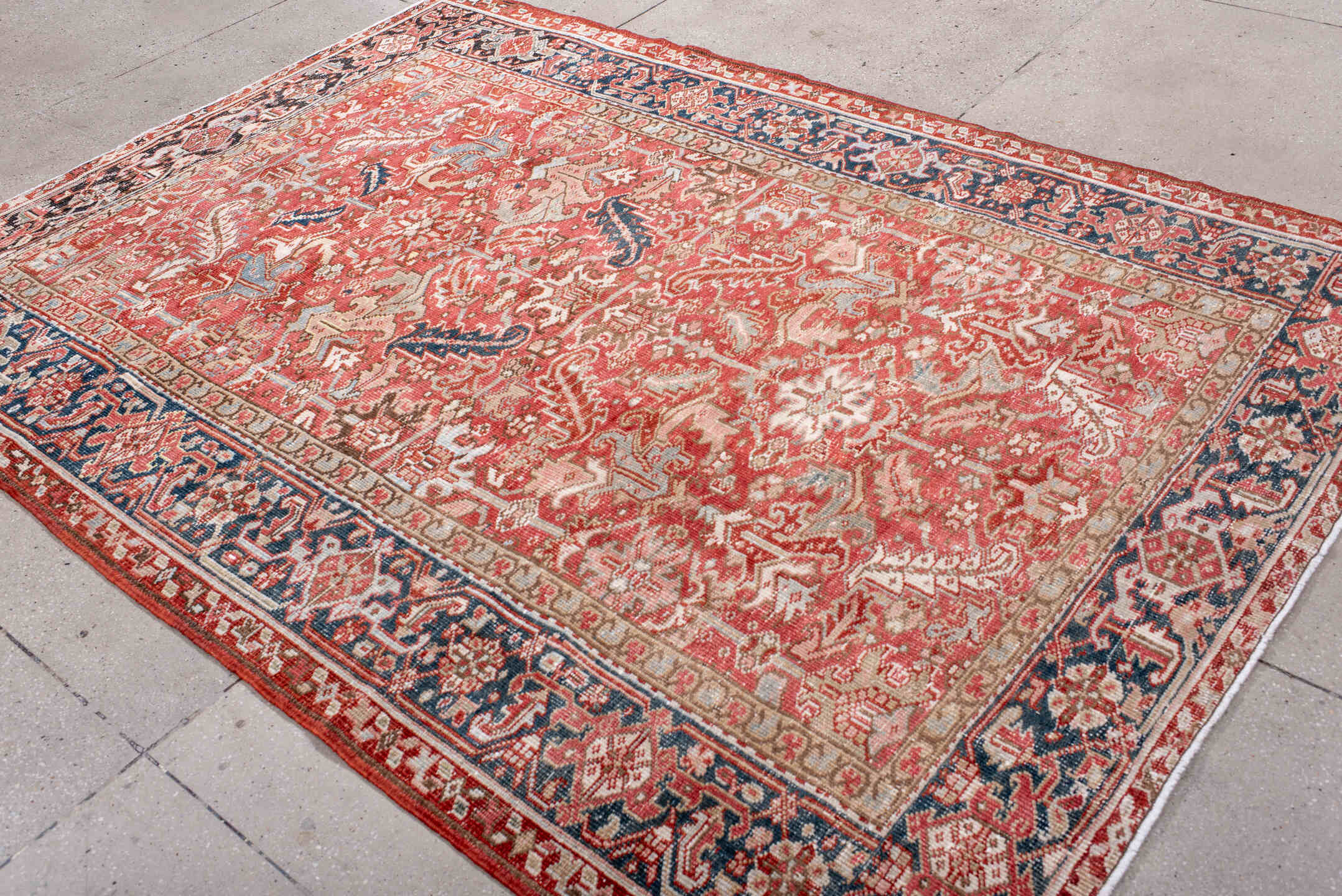 6' x 8' one-of-a-kind handmade antique Heriz medium size rug. Color palette: terra cotta, ivory, navy, soft blue, rust