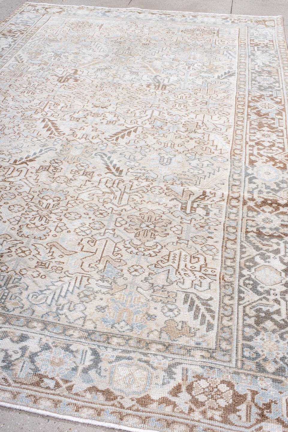 7' x 11' one-of-a-kind handmade antique Heriz large size rug. Color palette: ivory, taupe, light blue, camel, brown, cream