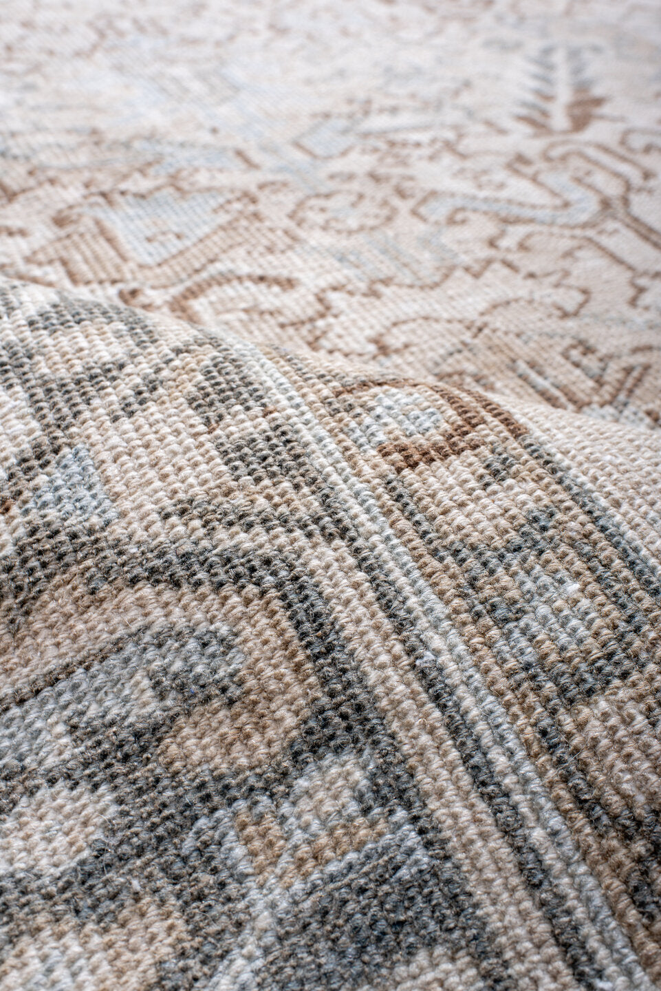 7' x 11' one-of-a-kind handmade antique Heriz large size rug. Color palette: ivory, taupe, light blue, camel, brown, cream