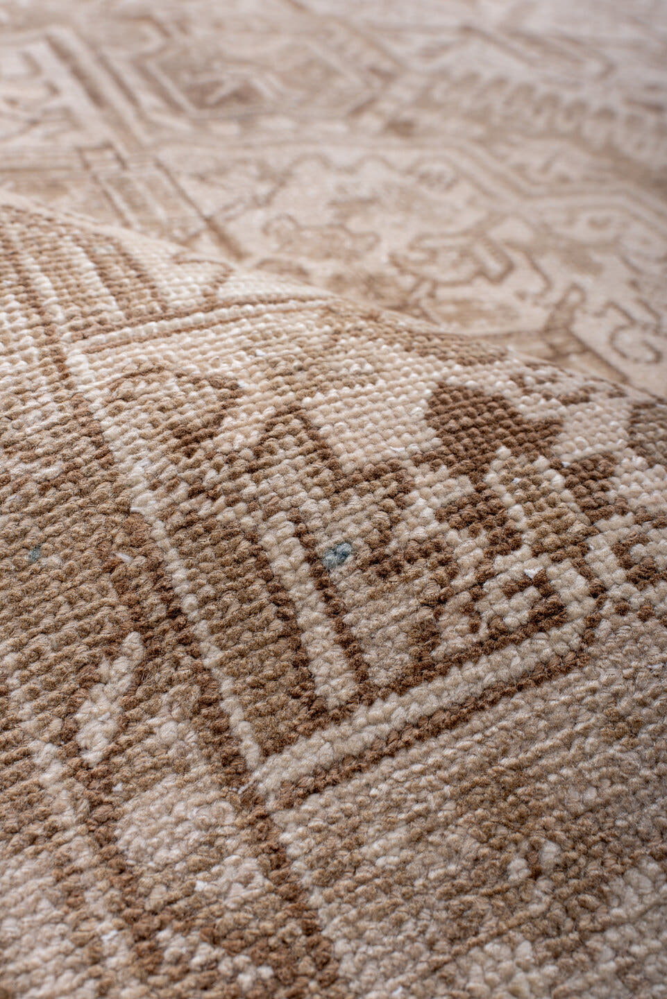 7' x 9' one-of-a-kind handmade antique Heriz rug. Color palette: ivory, camel, taupe, beige, sand, gray