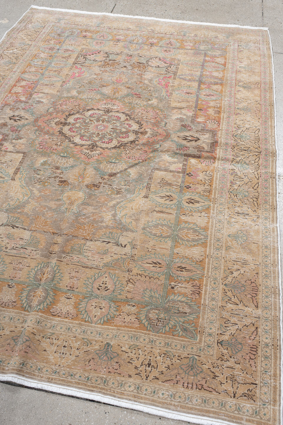 5' x 7' one-of-a-kind handmade antique Hereke rug. Color palette: blush, ivory, celadon, peach, coral, taupe, sage, brown