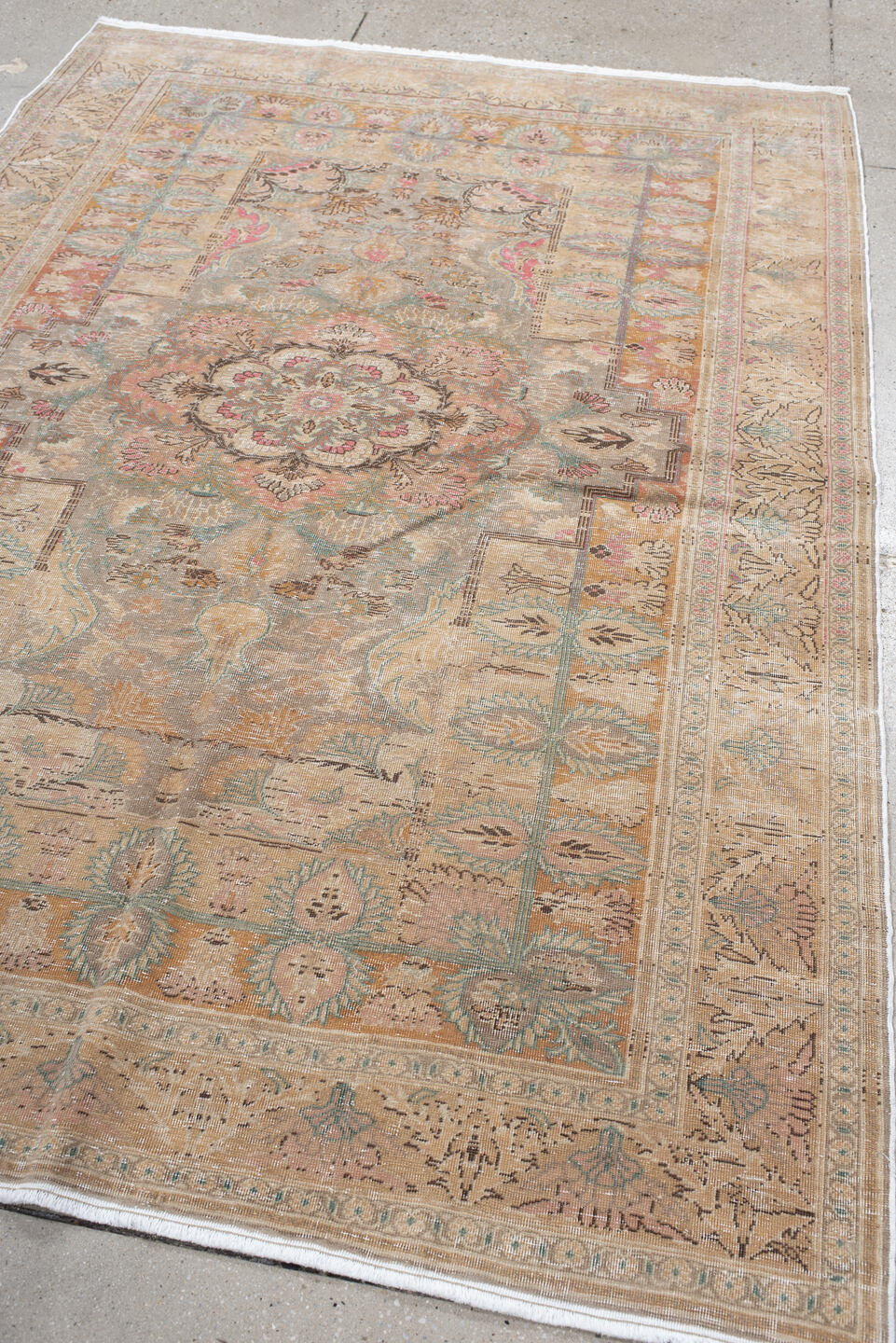 5' x 7' one-of-a-kind handmade antique Hereke rug. Color palette: blush, ivory, celadon, peach, coral, taupe, sage, brown